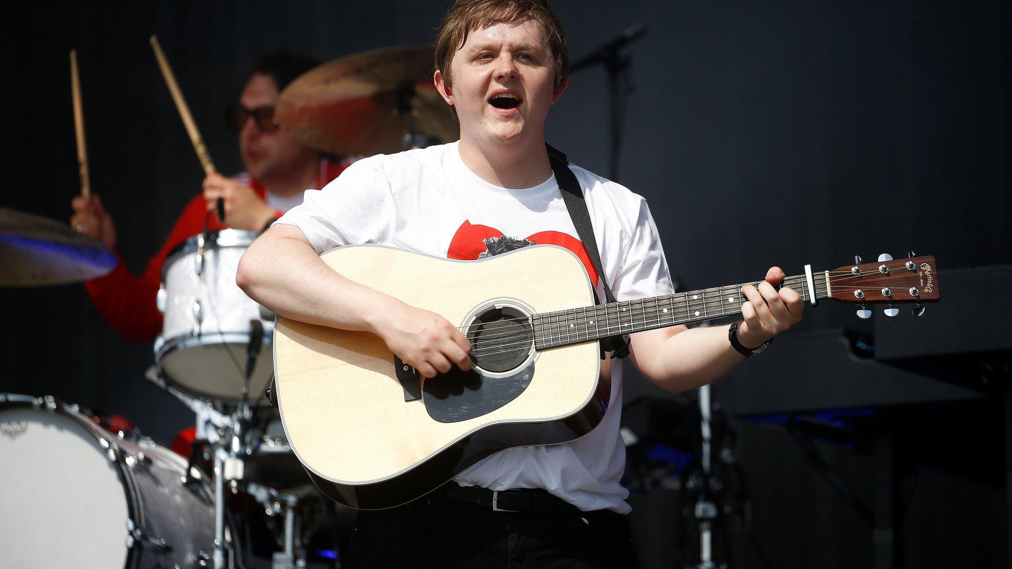 Lewis Capaldi plays his guitar at Glastonbury