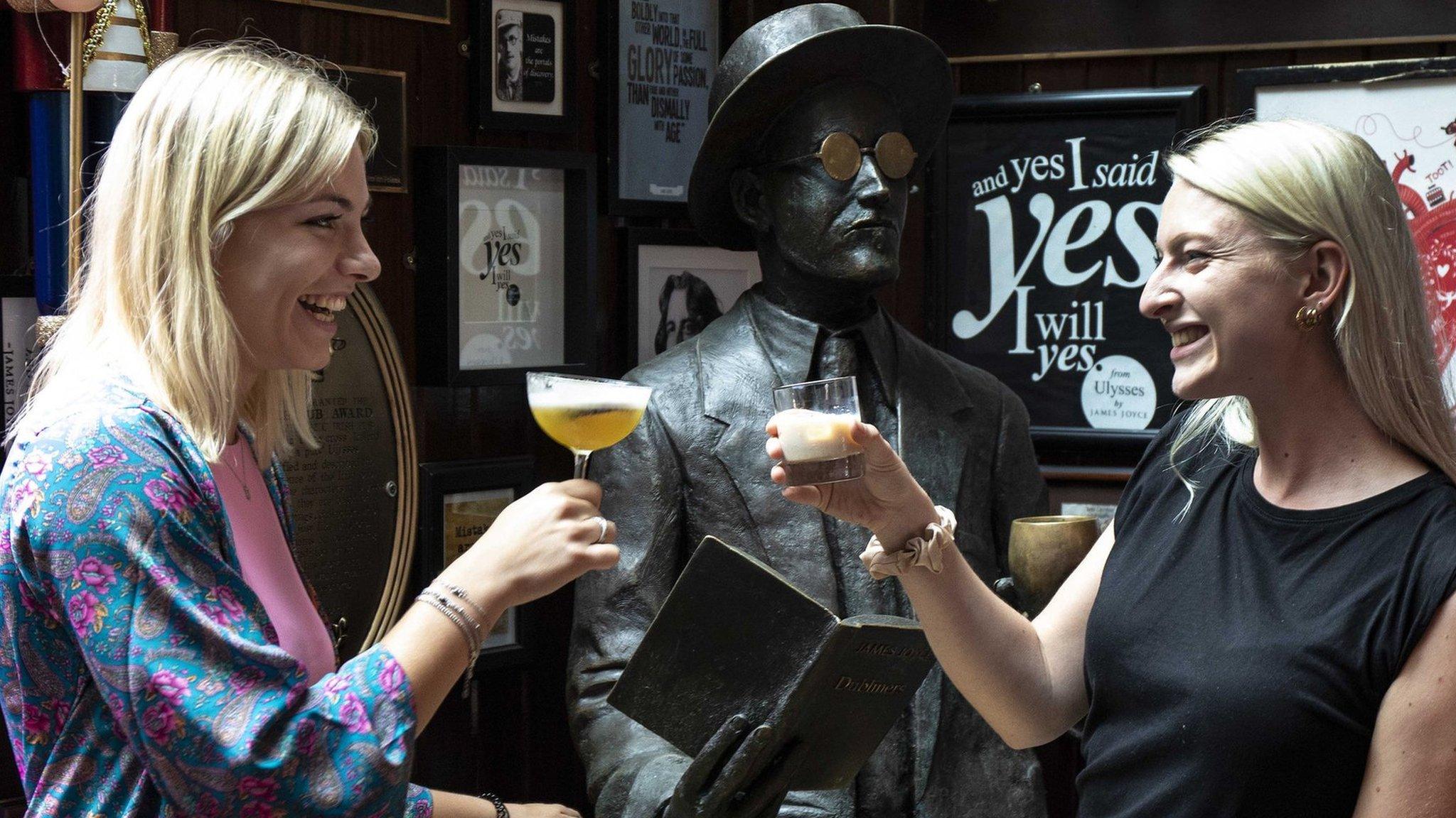 Two women drinking cocktails in a Dublin bar