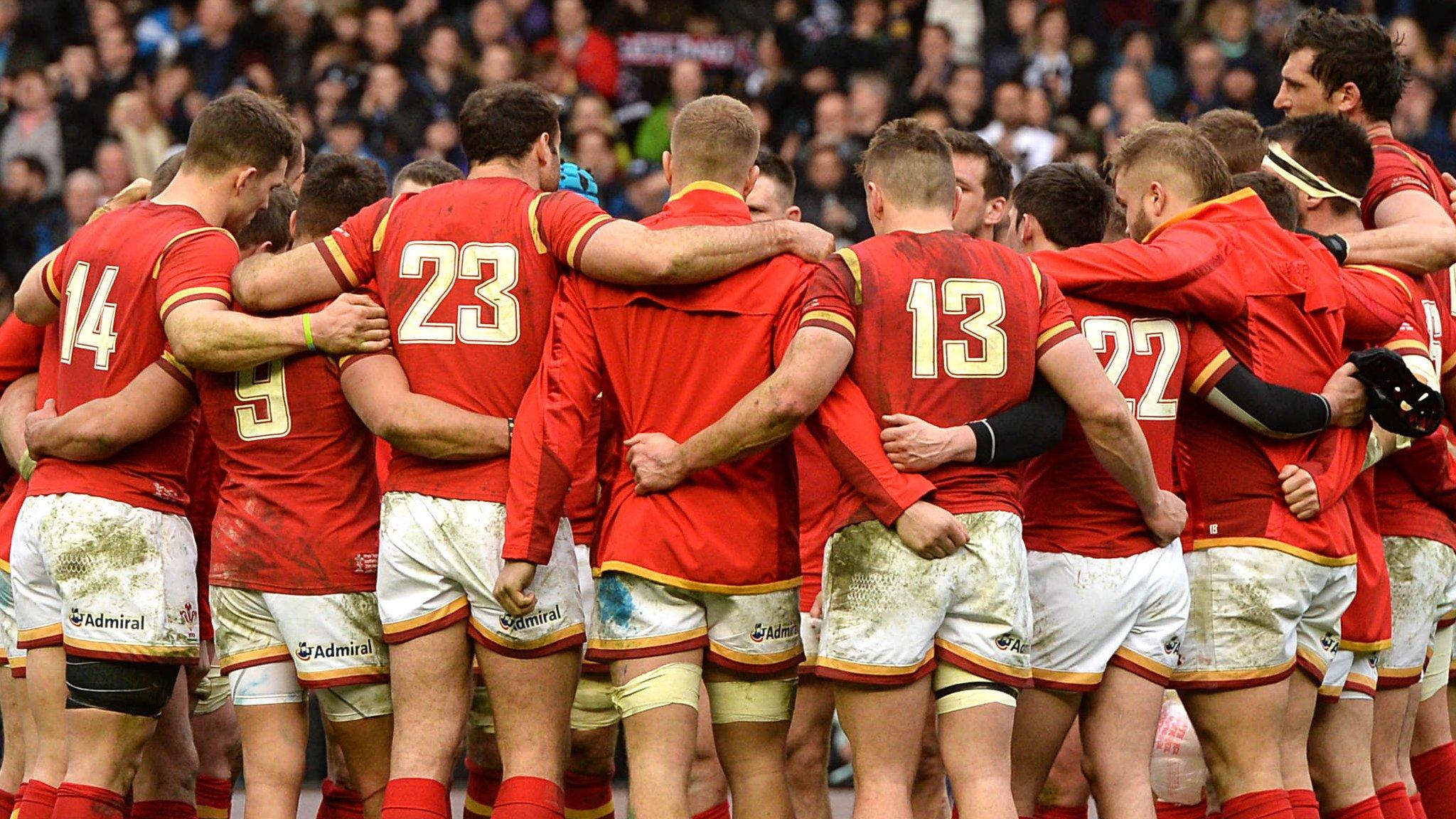Wales rugby team in a huddle post-match