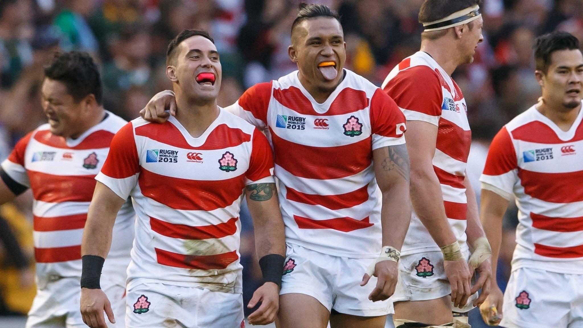 Japan players celebrate the win over South Africa in 2015