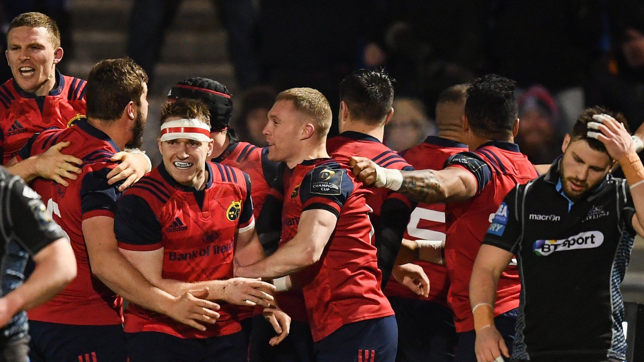 Munster celebrate their late winning try as Glasgow scrum-half Ali Price looks dejected