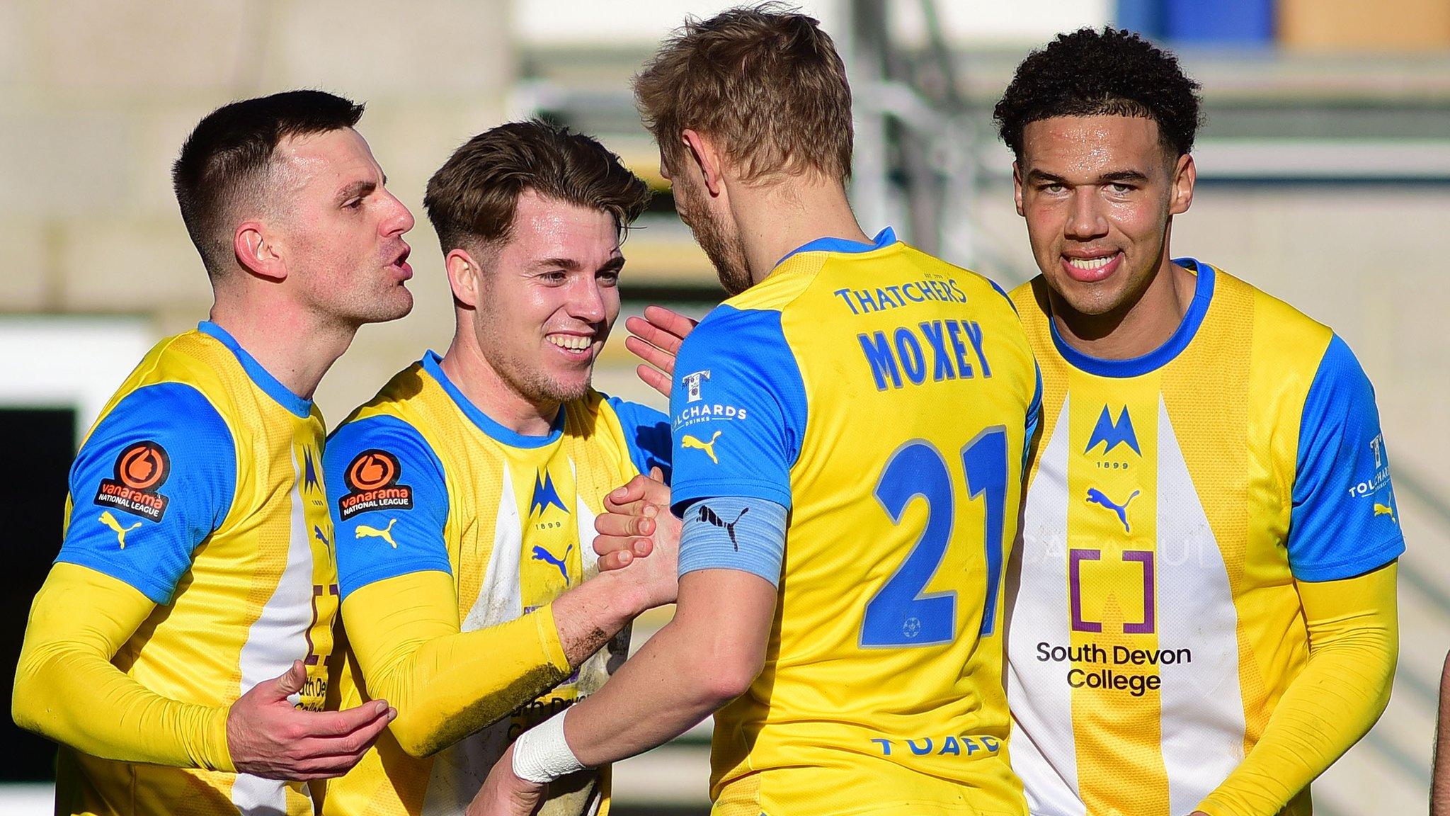 Torquay players celebrate a goal