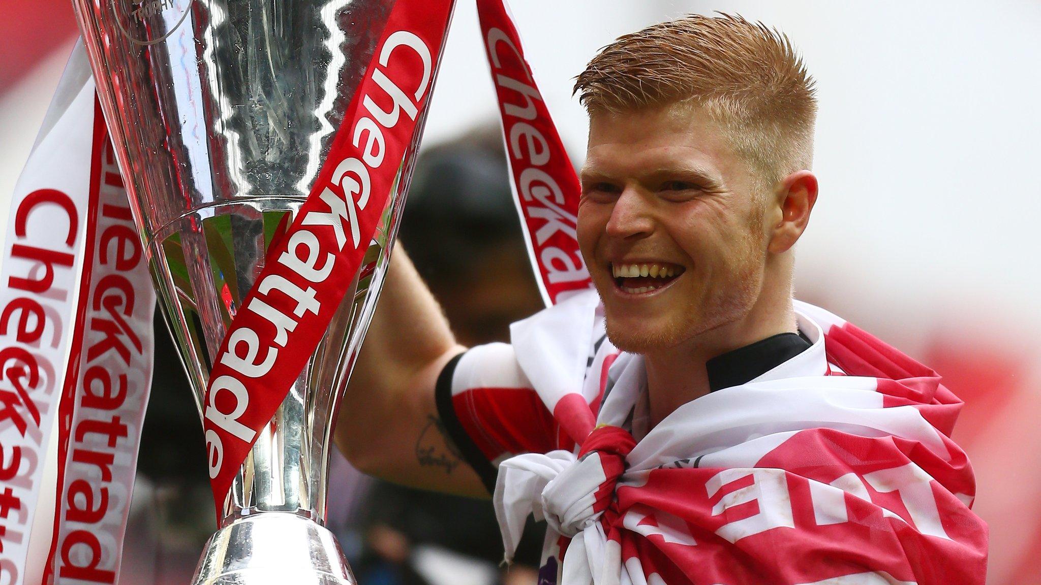 Elliott Whitehouse celebrates Lincoln City's victory in the Checkatrade Trophy final