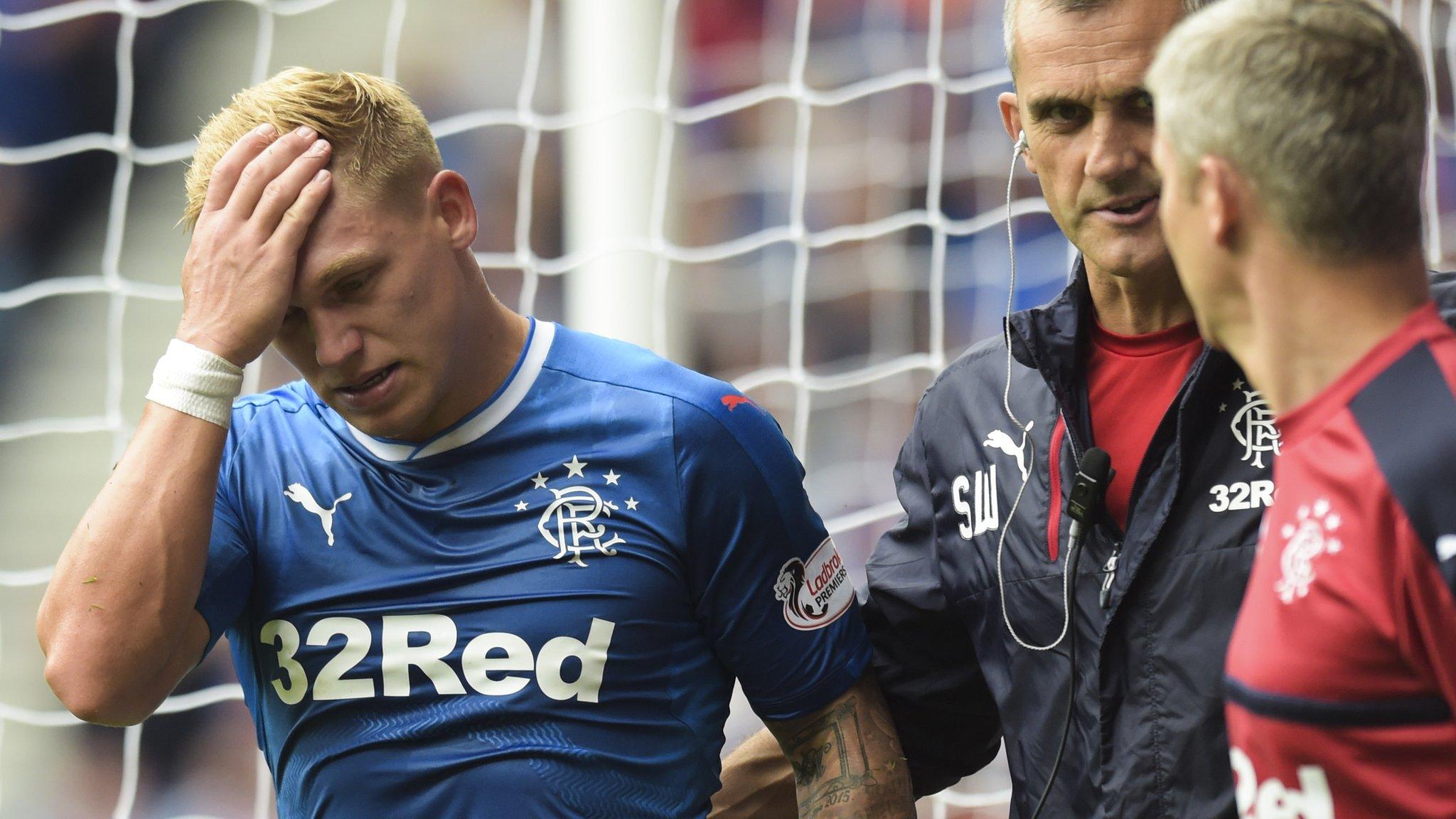 Martyn Waghorn looks dejected after being forced off injured against Hamilton