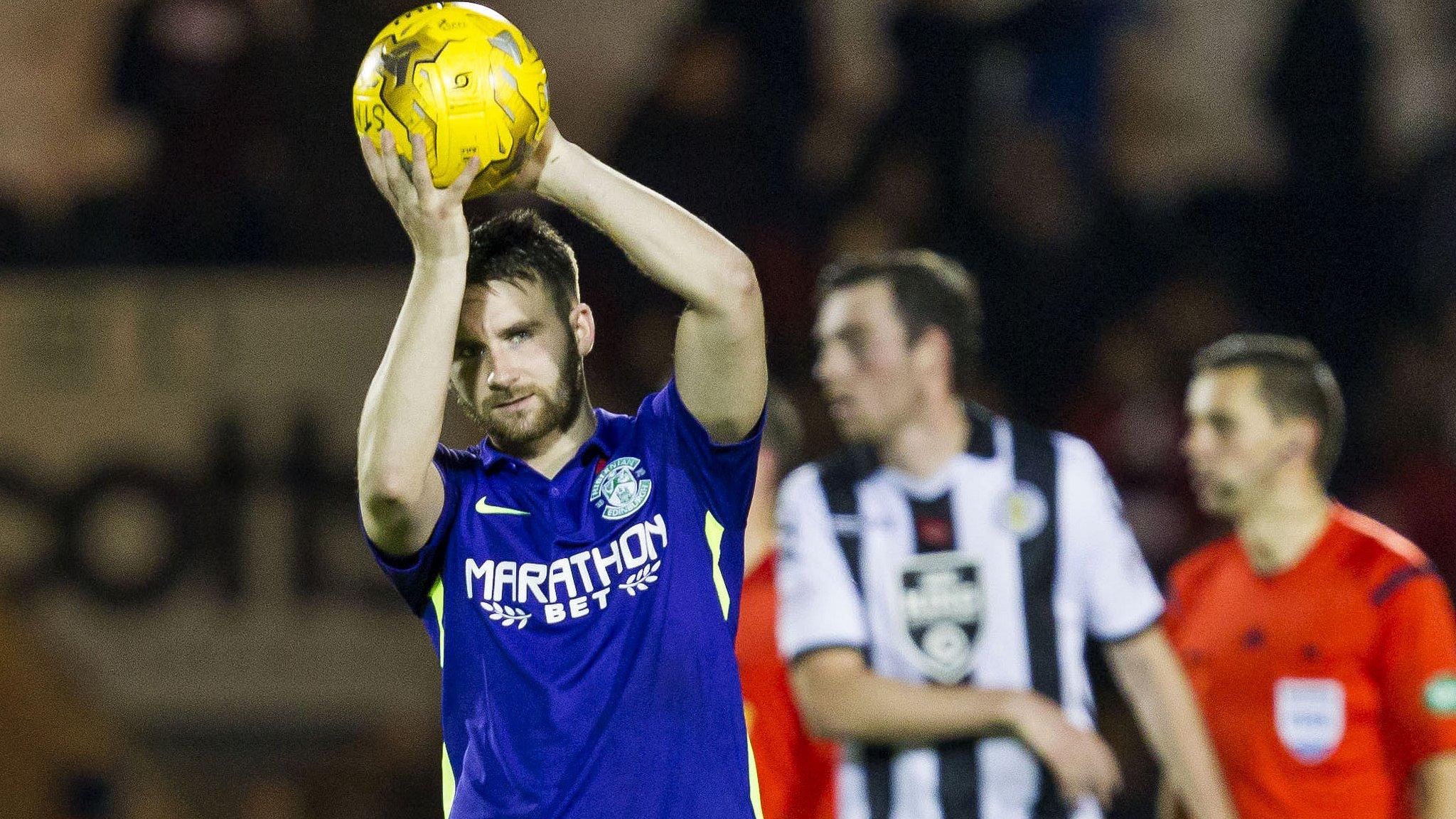 Hibernian hat-trick scorer James Keatings celebrates with the match ball