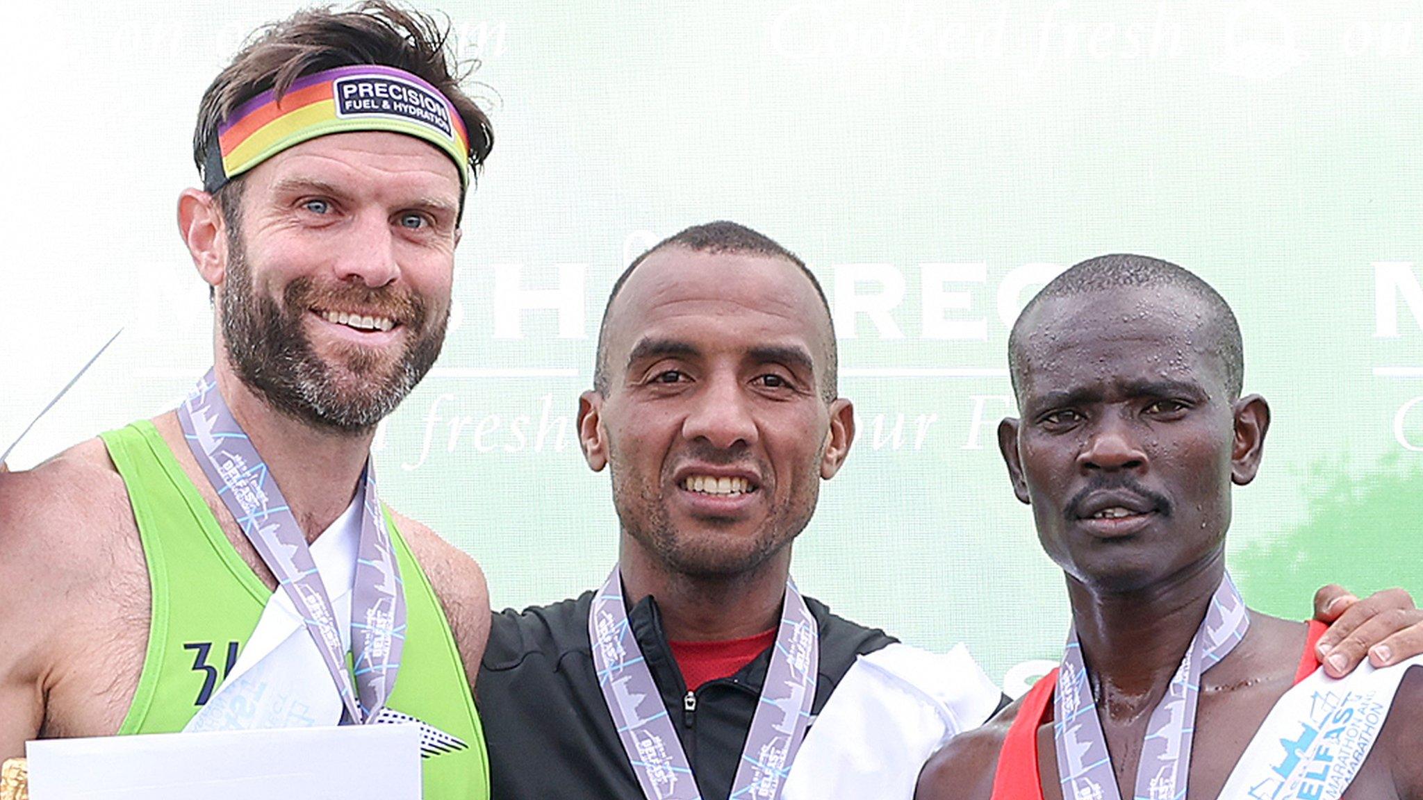 Belfast Marathon runner-up Adam Bowden, winner Mohamed Oumaarir and third-placed finisher Bernard Rotich