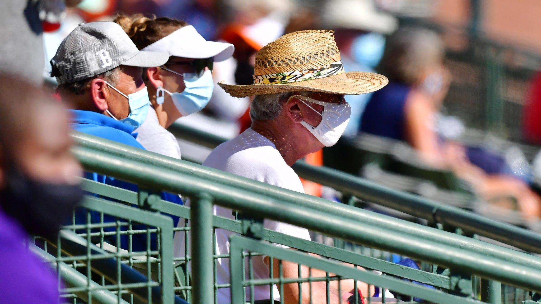 Masked fans watch baseball in 2021