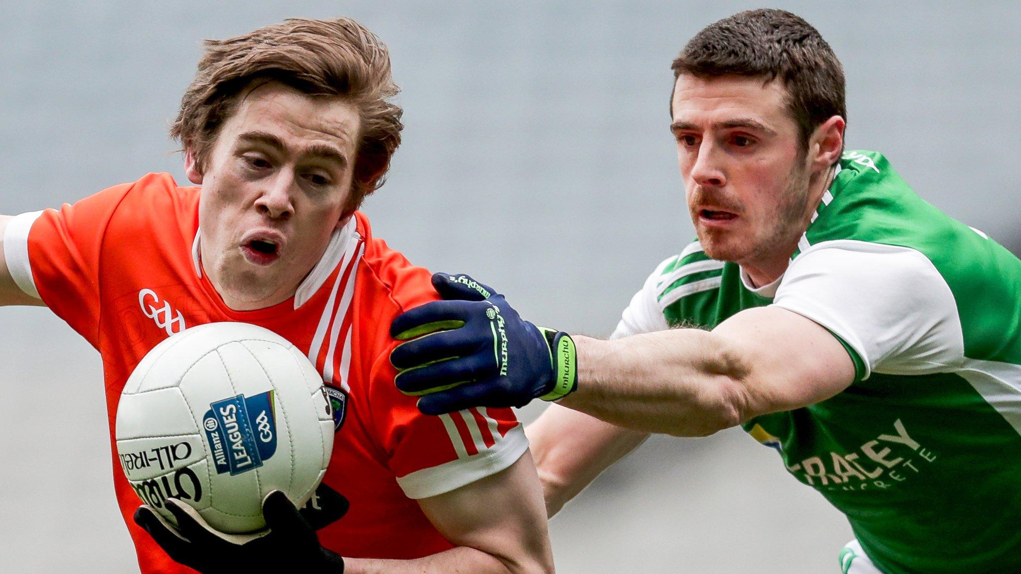 Fermanagh defender Mickey Jones challenges Armagh goalscorer Andrew Murnin