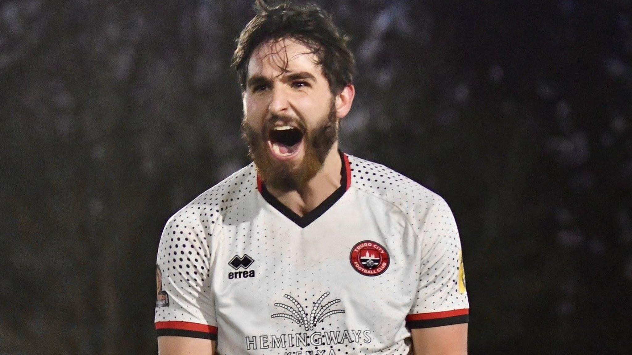 Truro City player celebrates a goal