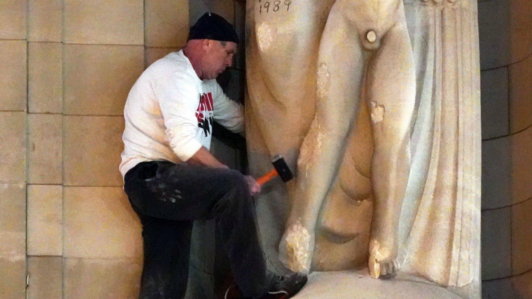 A man attacks the Prospero and Ariel statue outside Broadcasting House