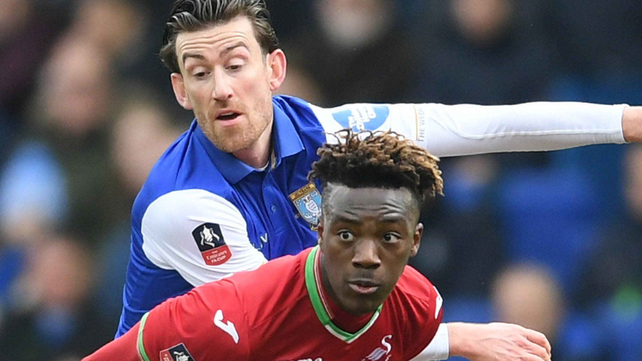 Swansea's Tammy Abraham and Wednesday's David Jones