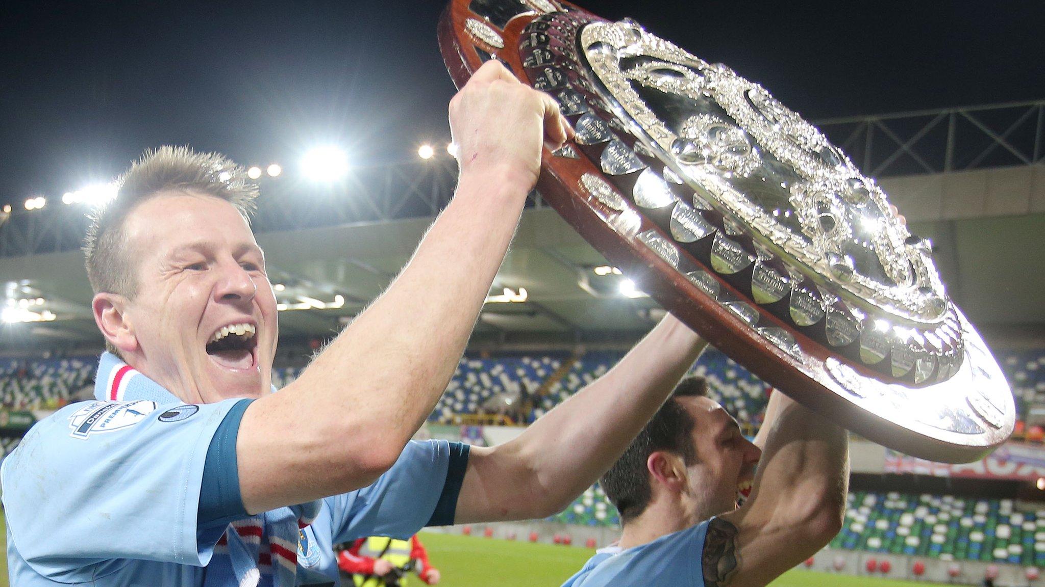 Ballymena pair Allan Jenkins and Jim Ervin celebrate with the Co Antrim Shiled