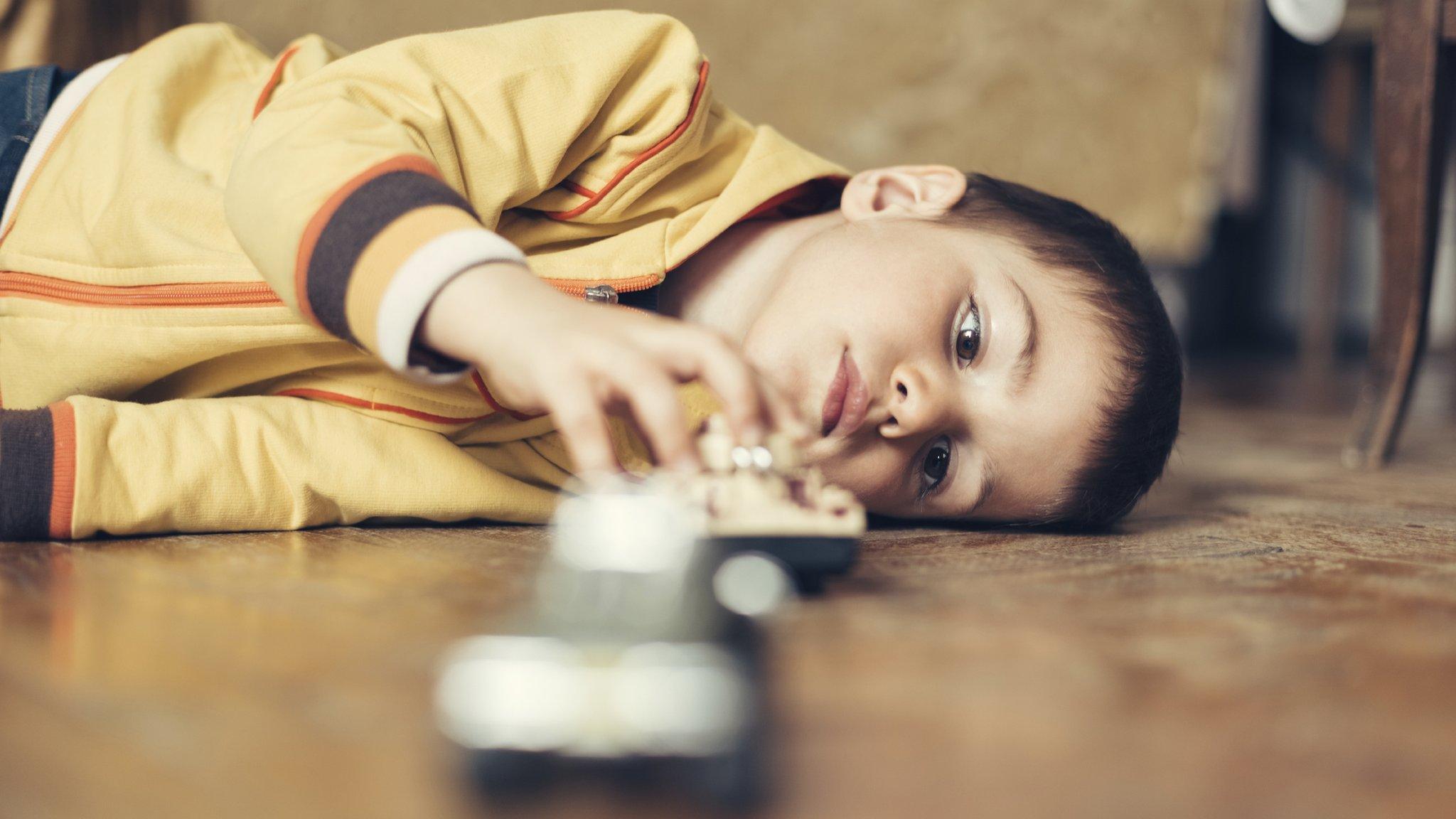 Child playing with toy (Posed by model)