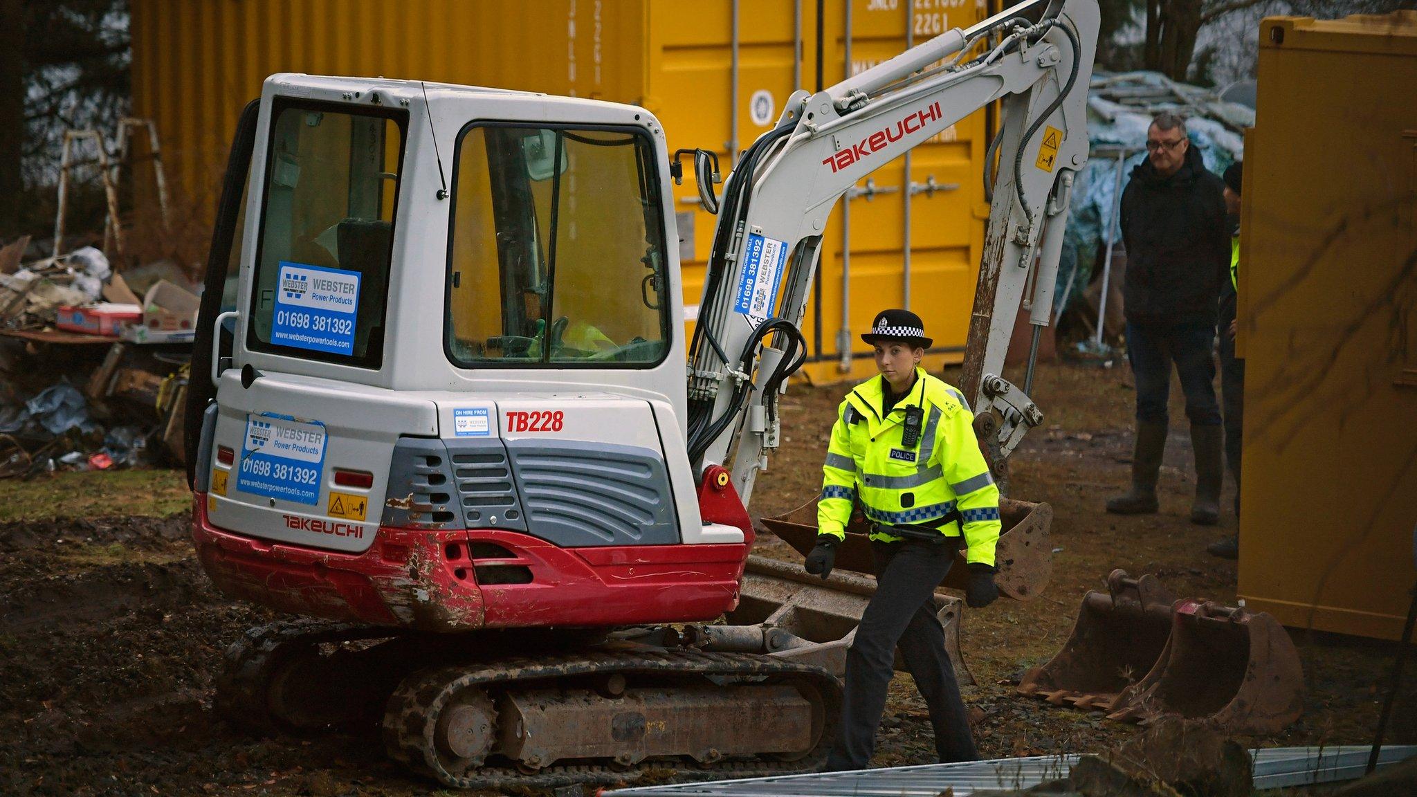 A digger is being used to help with excavations at the house where Ms Fleming lived