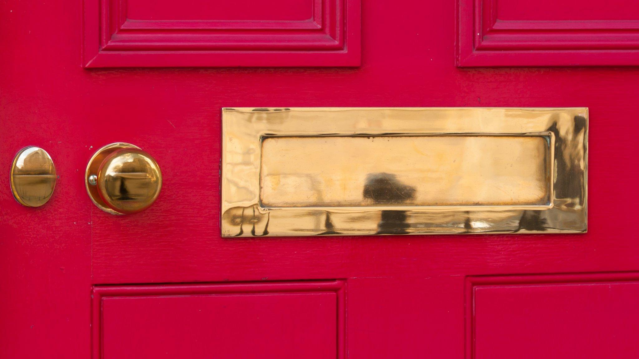 letter box on red door