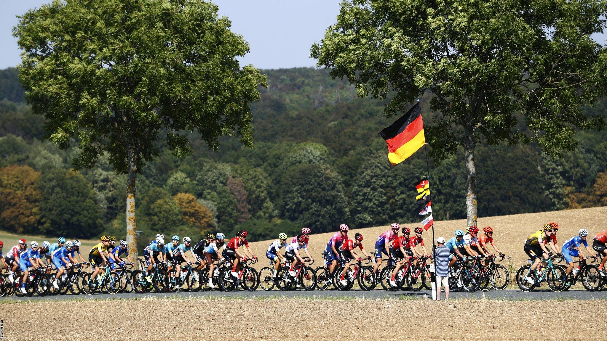 EISENACH, GERMANY - AUGUST 31: Peloton / Landscape / Fans / Flag / during the 34th Deutschland Tour 2019, Stage 3 a 189km stage from Göttingen to Eisenach / @DeineTour / #DeutschlandTour / on August 31, 2019 in Eisenach, Germany. (Photo by Bas Czerwinski/Getty Images)