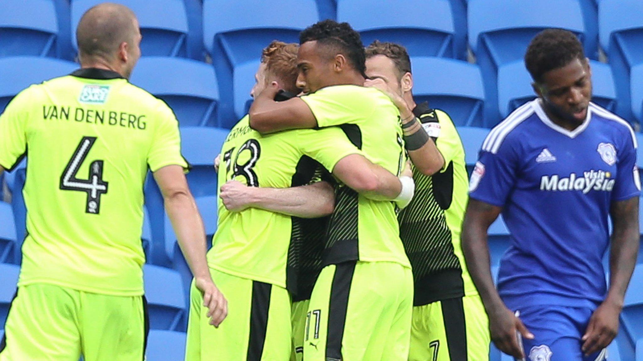 Reading players celebrate with Yann Kermorgant after his late winner