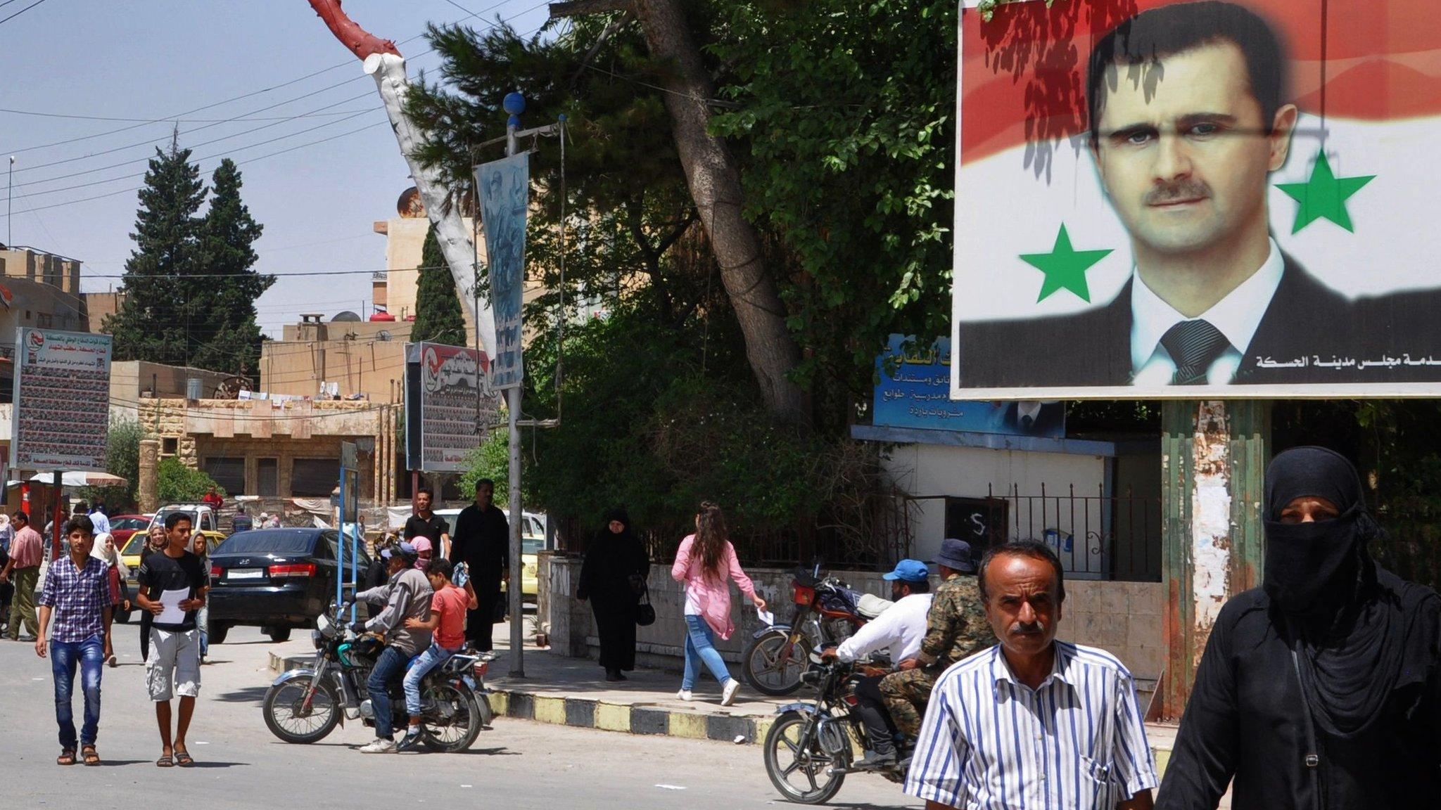 A poster of President Assad in a square in Damascus, Syria