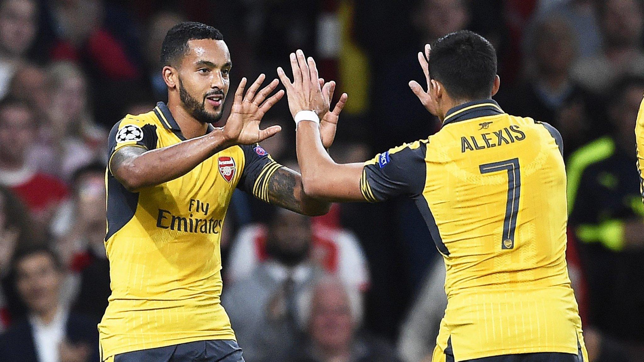 Walcott and Sanchez celebrate