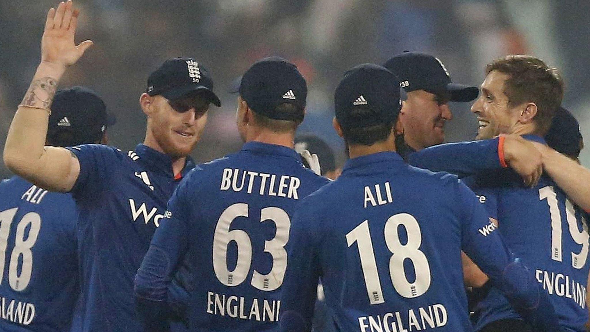 England's one-day cricketers celebrate a wicket against India