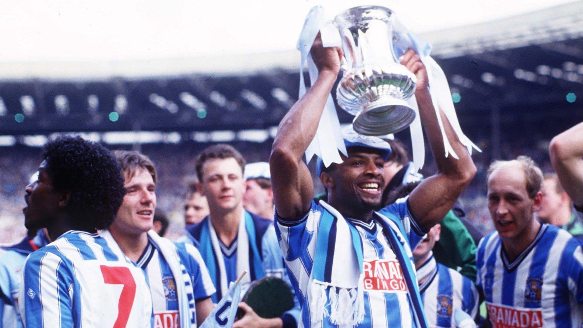 Cyrille Regis holds the FA Cup