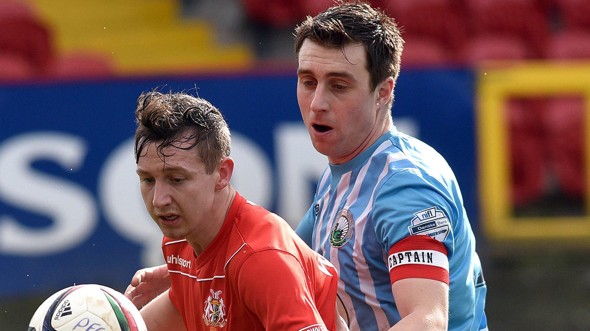 Portadown's Mikey Withers and Warrenpoint's John Boyle