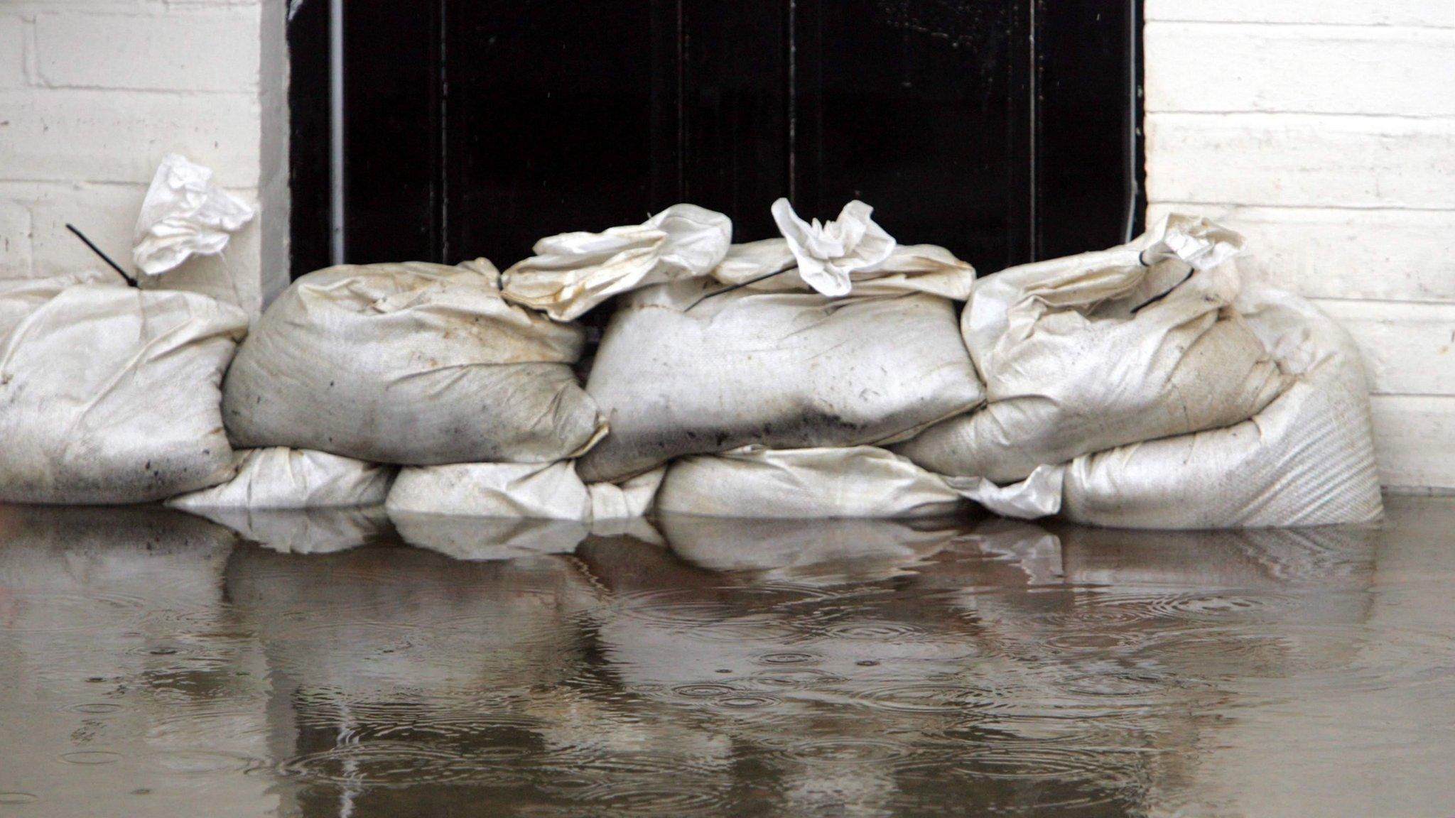 Sandbags outside flooded property