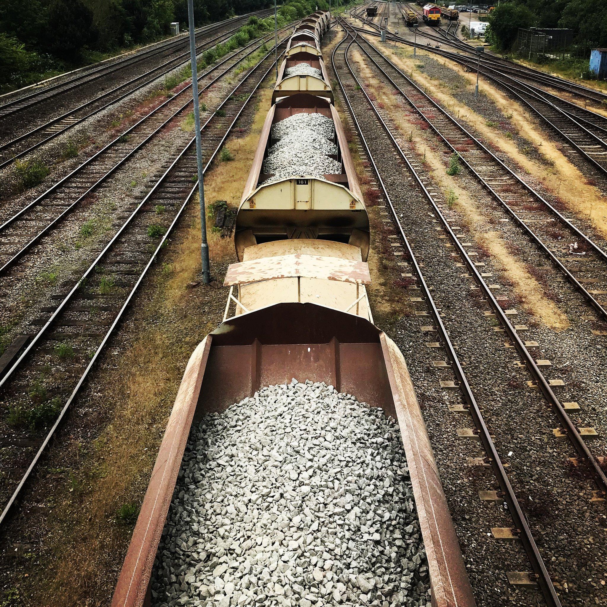 A line of train carriages photographed from New Hinksey Bridge