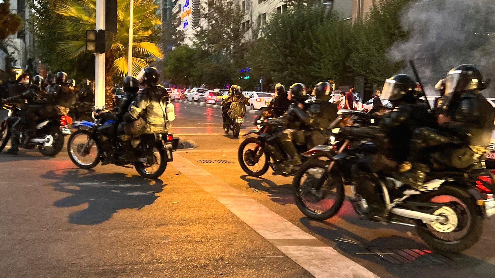 File photo showing Iranian riot police riding motorcycles during a protest in Tehran, Iran (19 September 2022)