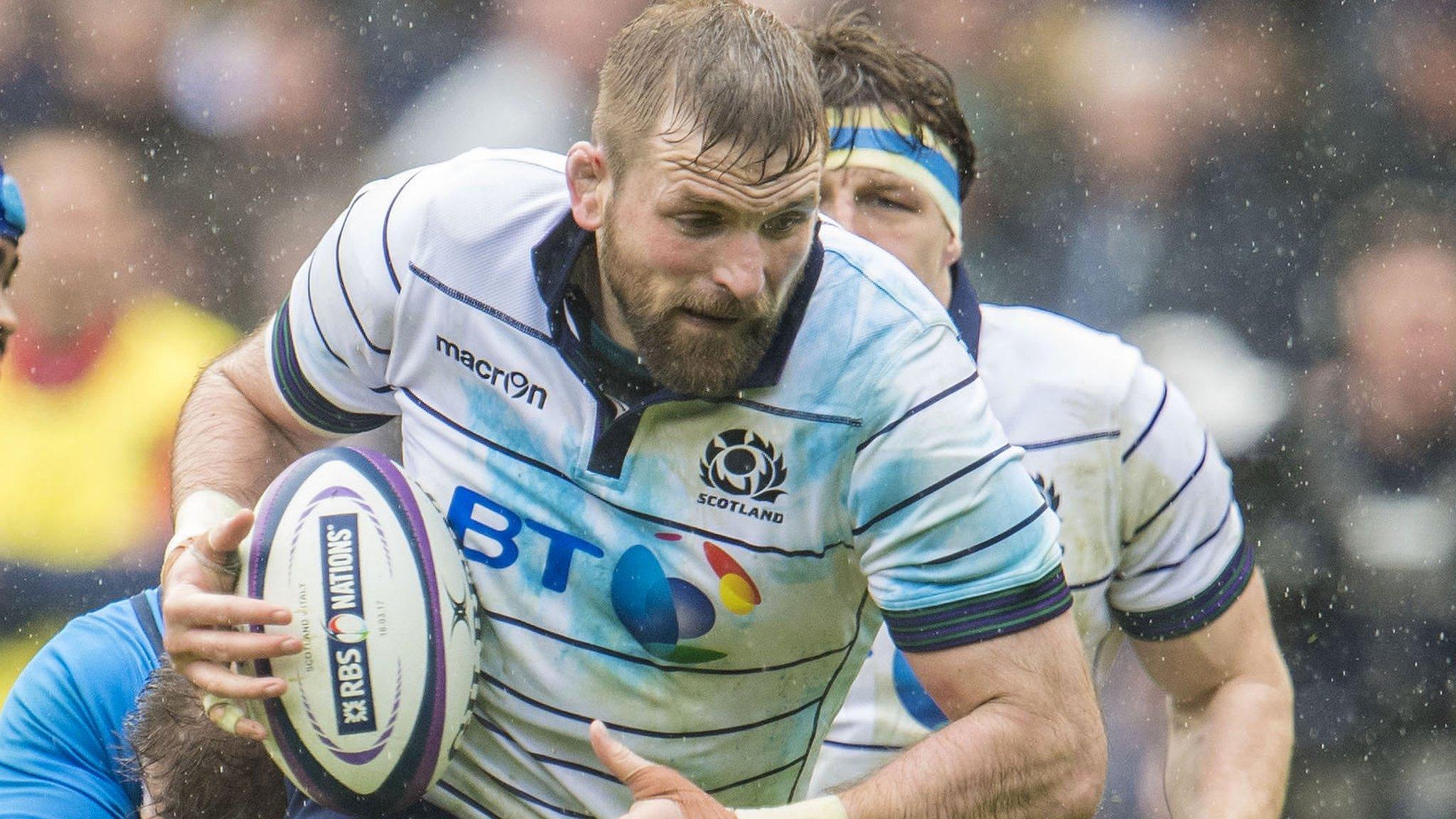 John Barclay carries the ball for Scotland against Italy