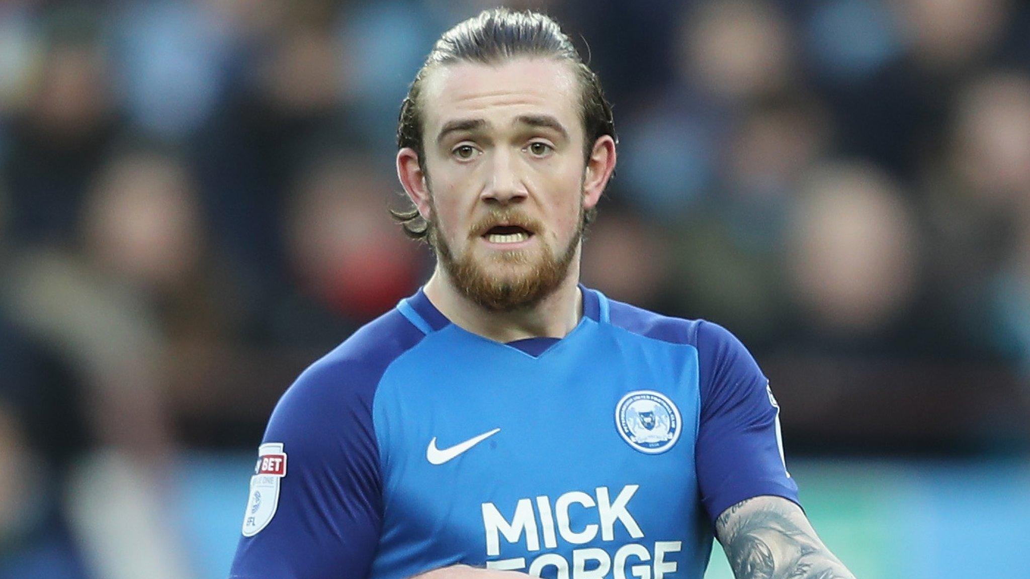 Jack Marriott gestures towards a team-mate