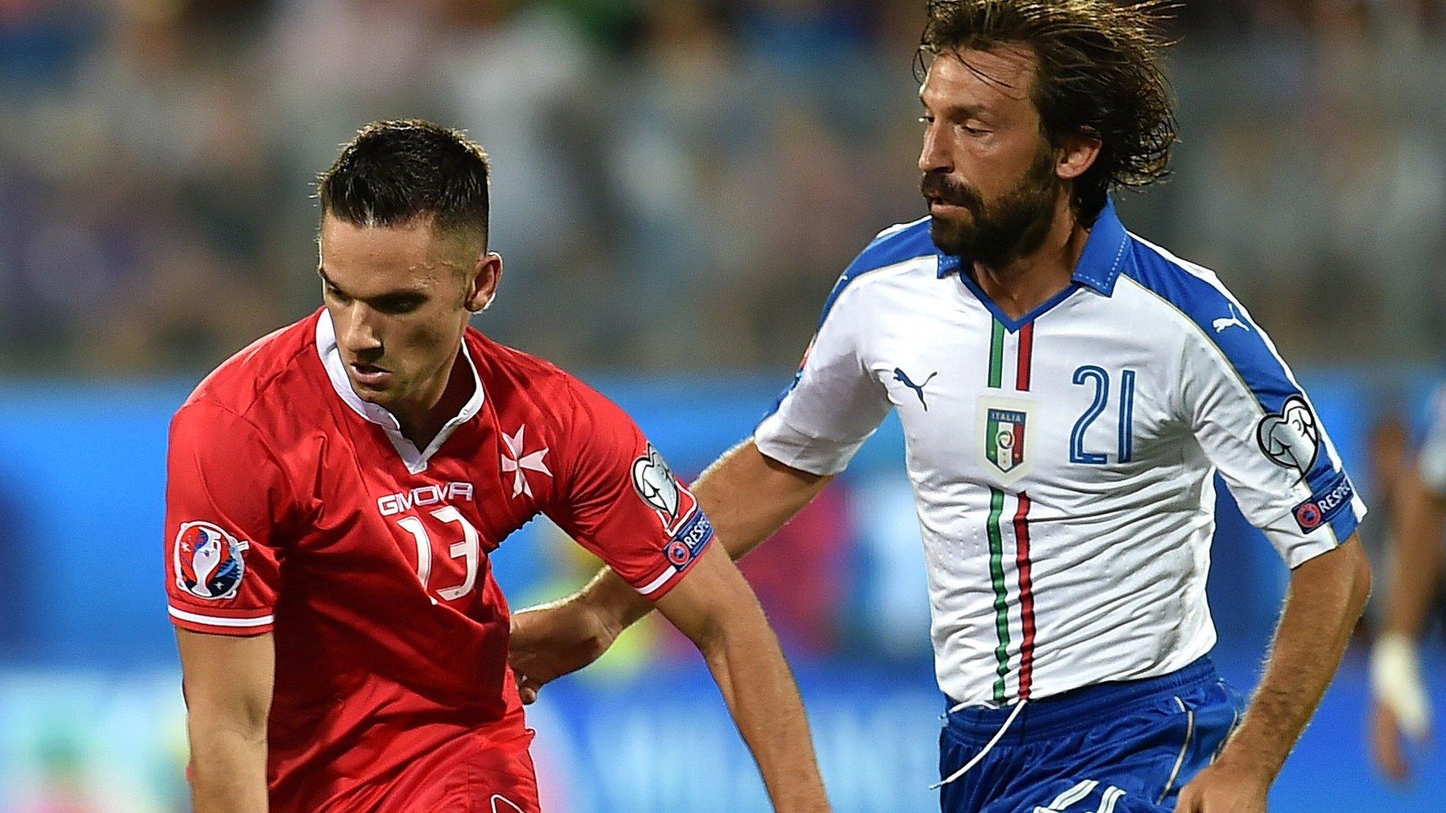 Malta's Andre Schembri in action against Italy's Andrea Pirlo