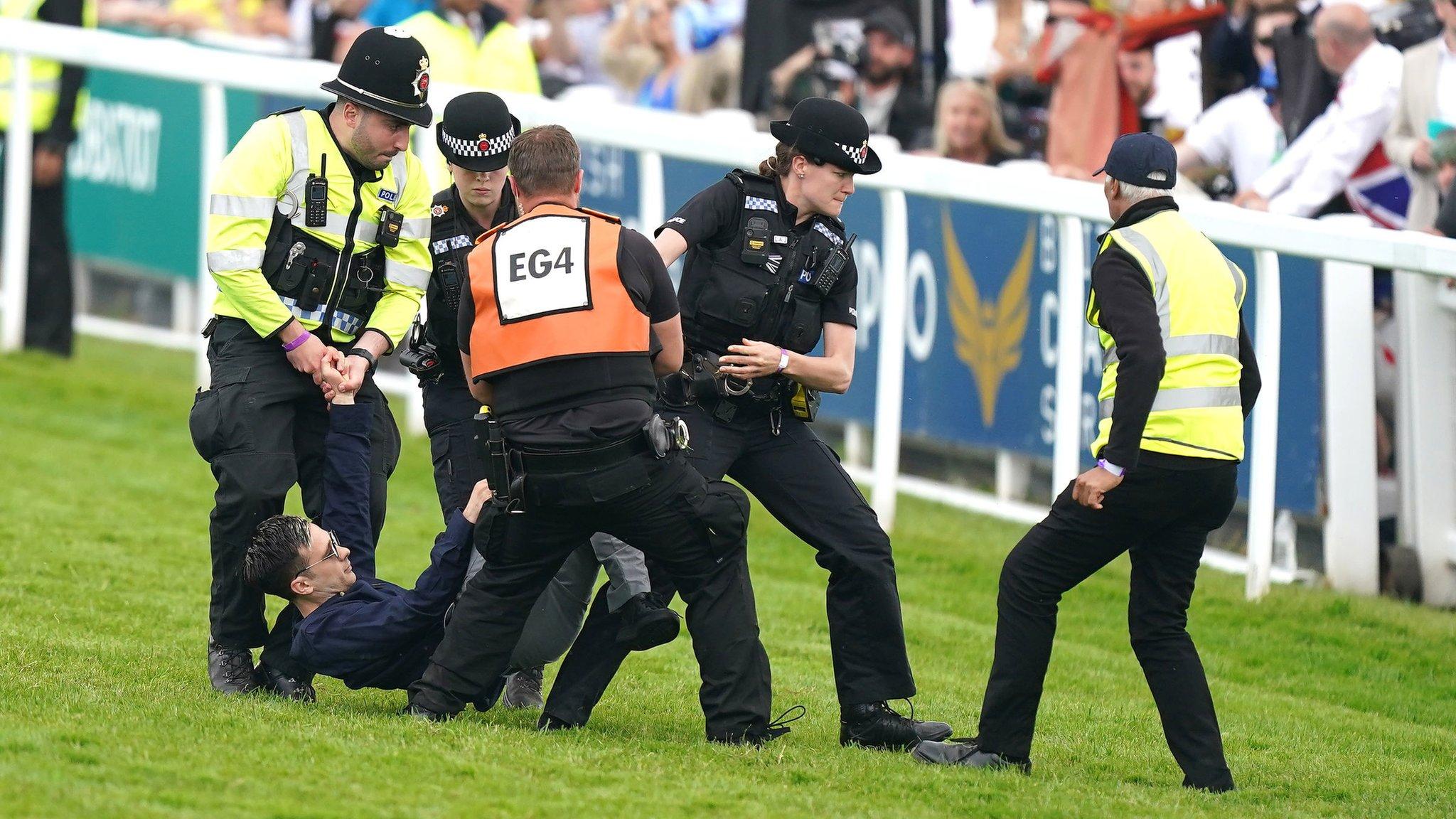 Protestor is tackled by police