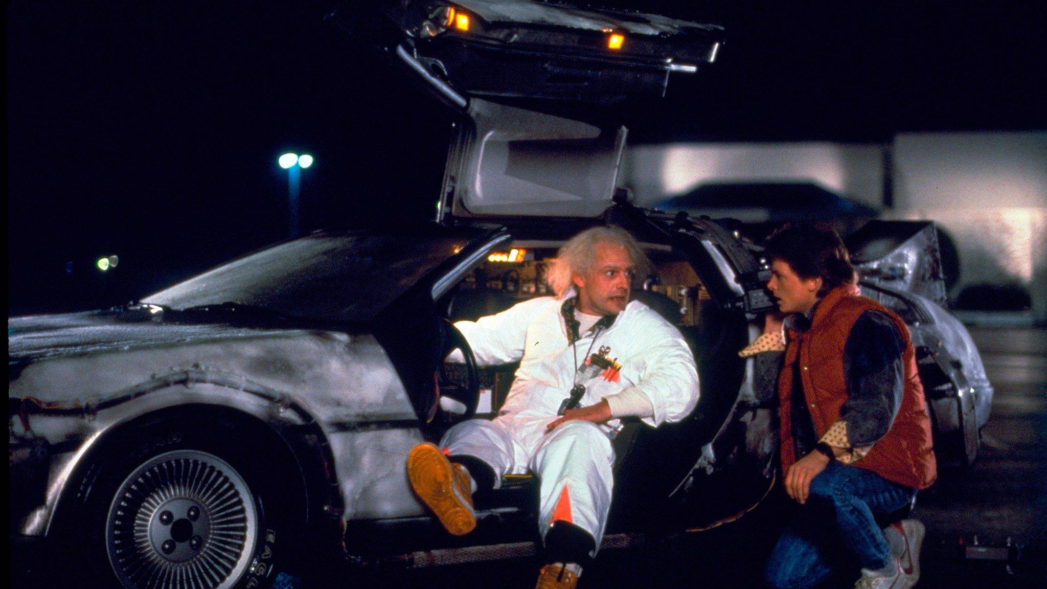 This photo provided by Universal Pictures Home Entertainment shows Christopher Lloyd, left, as Dr. Emmett Brown, and Michael J. Fox as Marty McFly in the 1985 film, 'Back to the Future.'