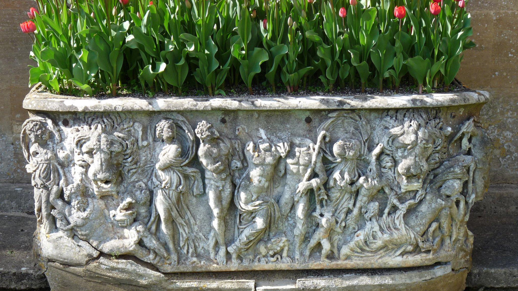 Plant pot / Roman sarcophagus in garden