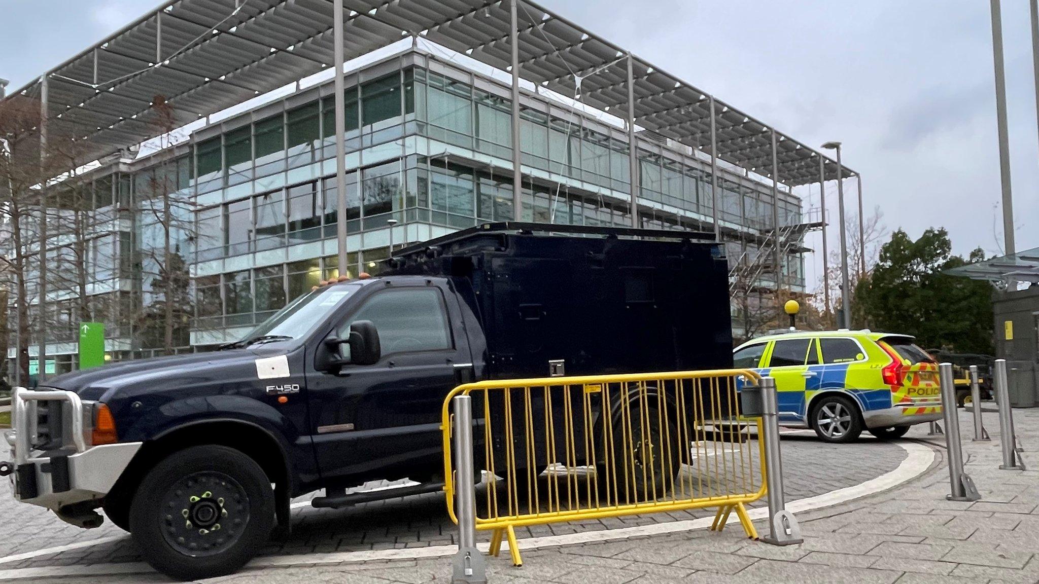 Armed Met Police vehicles guarding the offices of Iran International in Chiswick on Thursday.