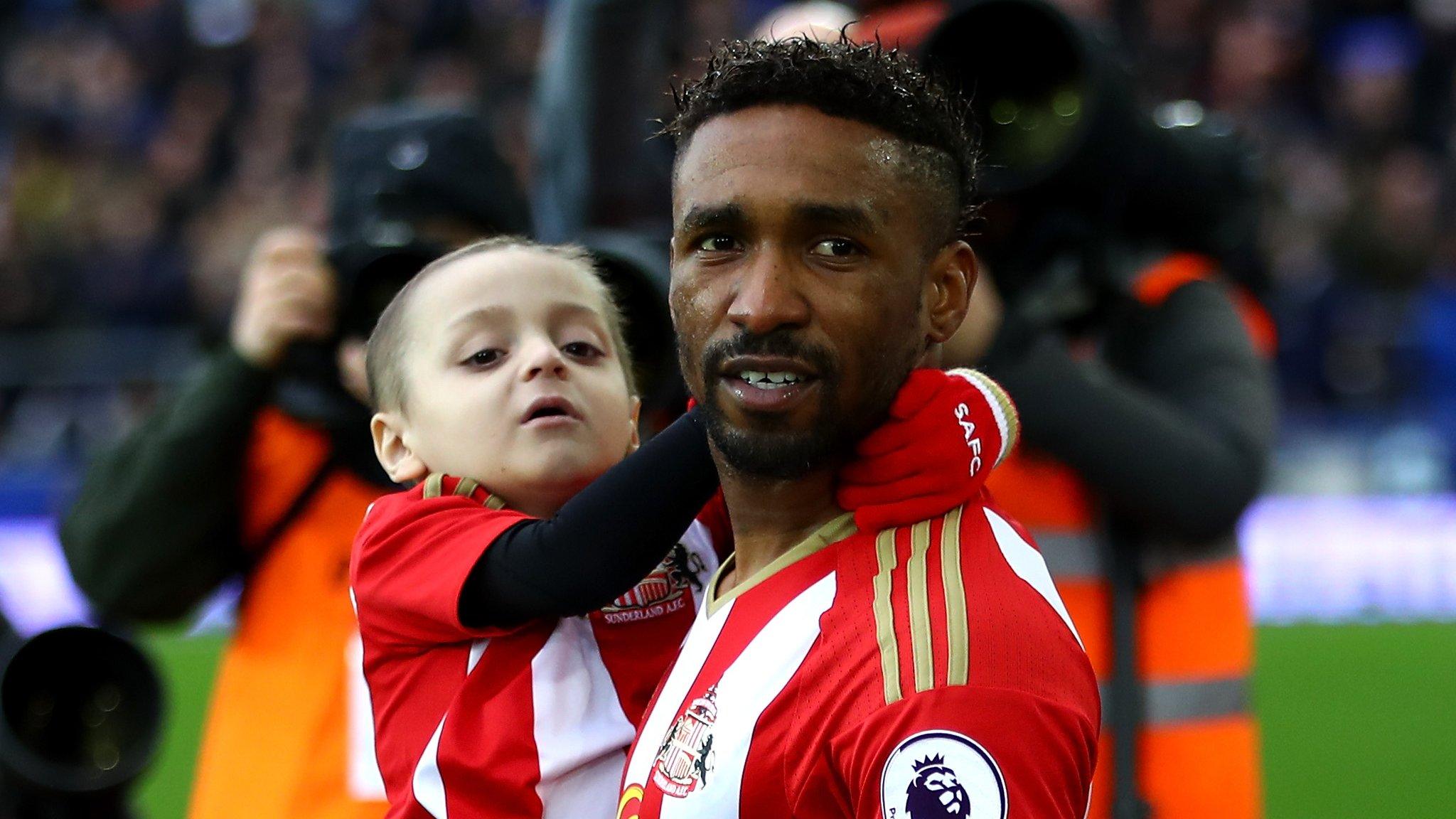 Jermain Defoe with Bradley Lowery