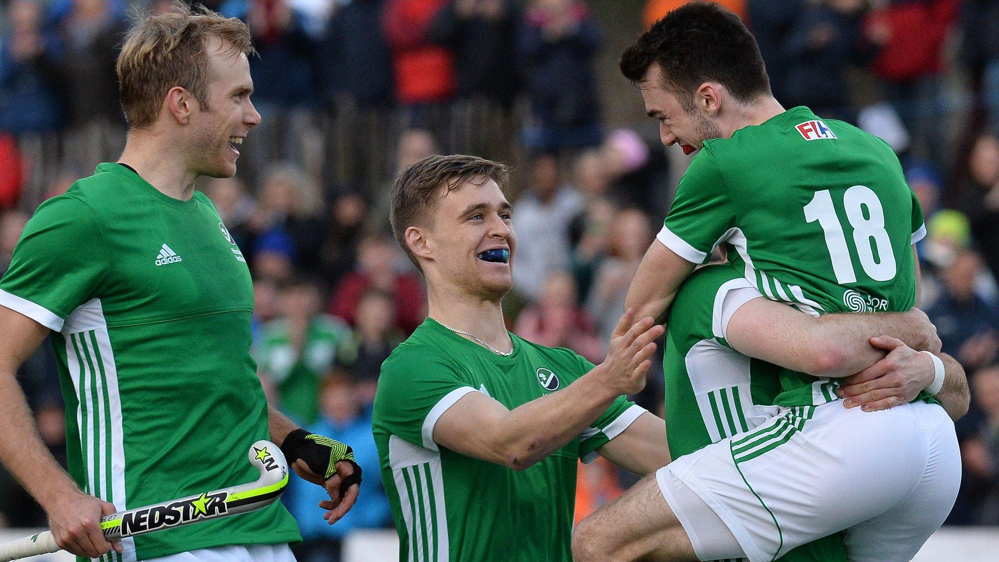 Johnny McKee is lifted in the air after scoring the winning penalty for Ireland