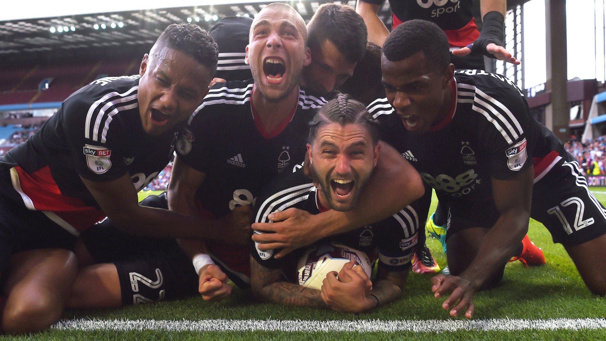 Nottingham Forest players celebrate Henri Lansbury's late equaliser against Aston Villa