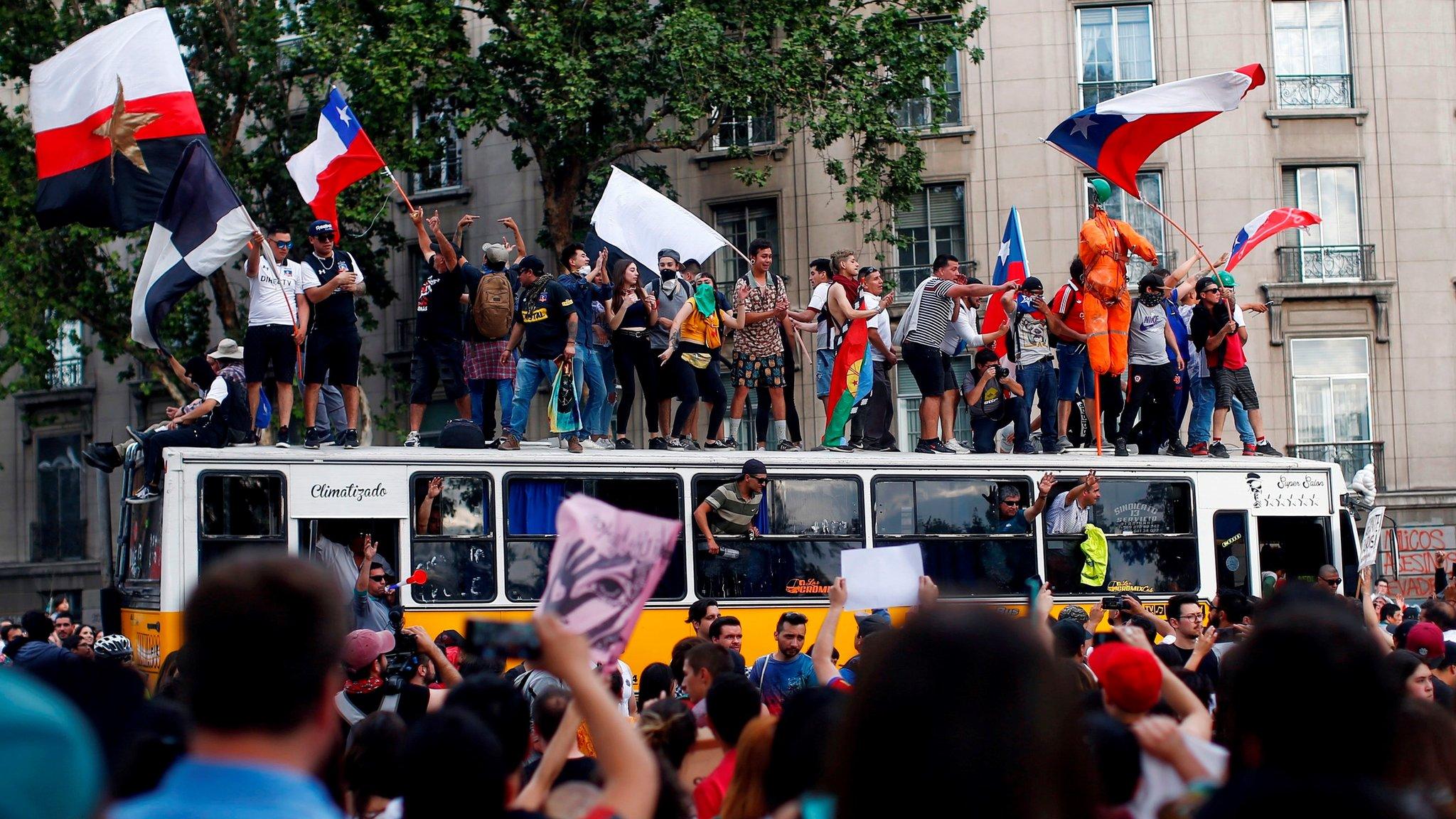 People demonstrate in Santiago, on 25 October, 2019.