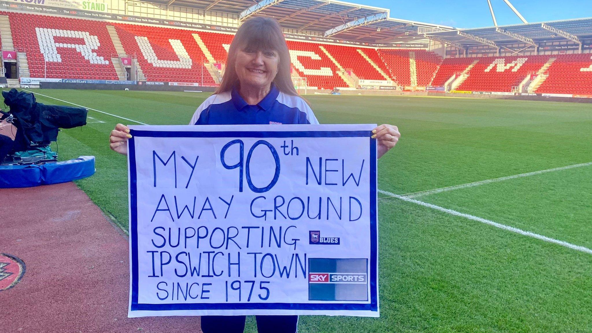 Angela Howarth holding a sign at Rotherham's New York Stadium