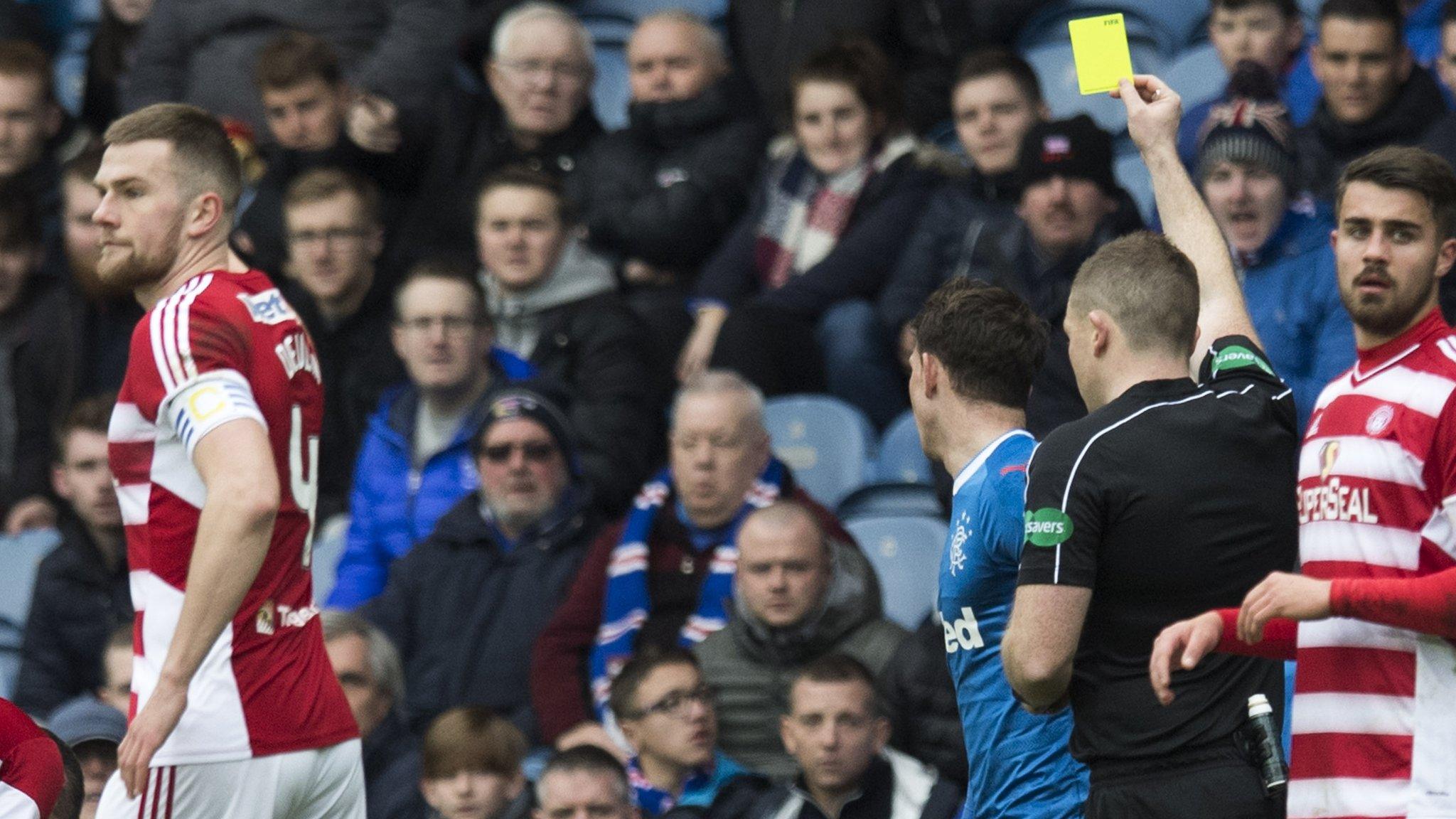 Referee John Beaton yellow carded Rangers striker Joe Garner for a wild challenge on Hamilton's Dougie Imrie