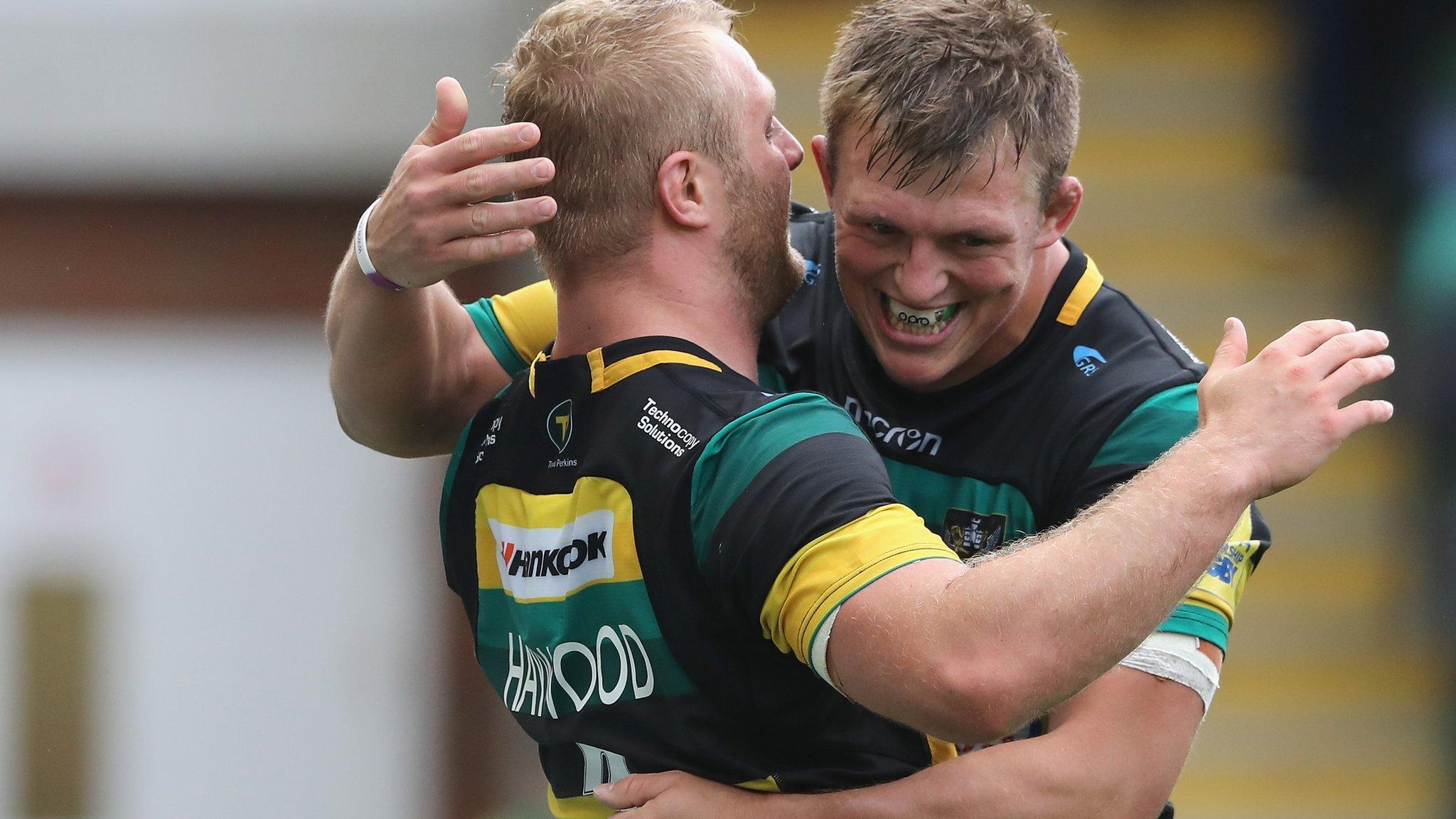 Mikey Haywood (L) of Northampton Saints celebrates with team mate Alex Waller after scoring their third try