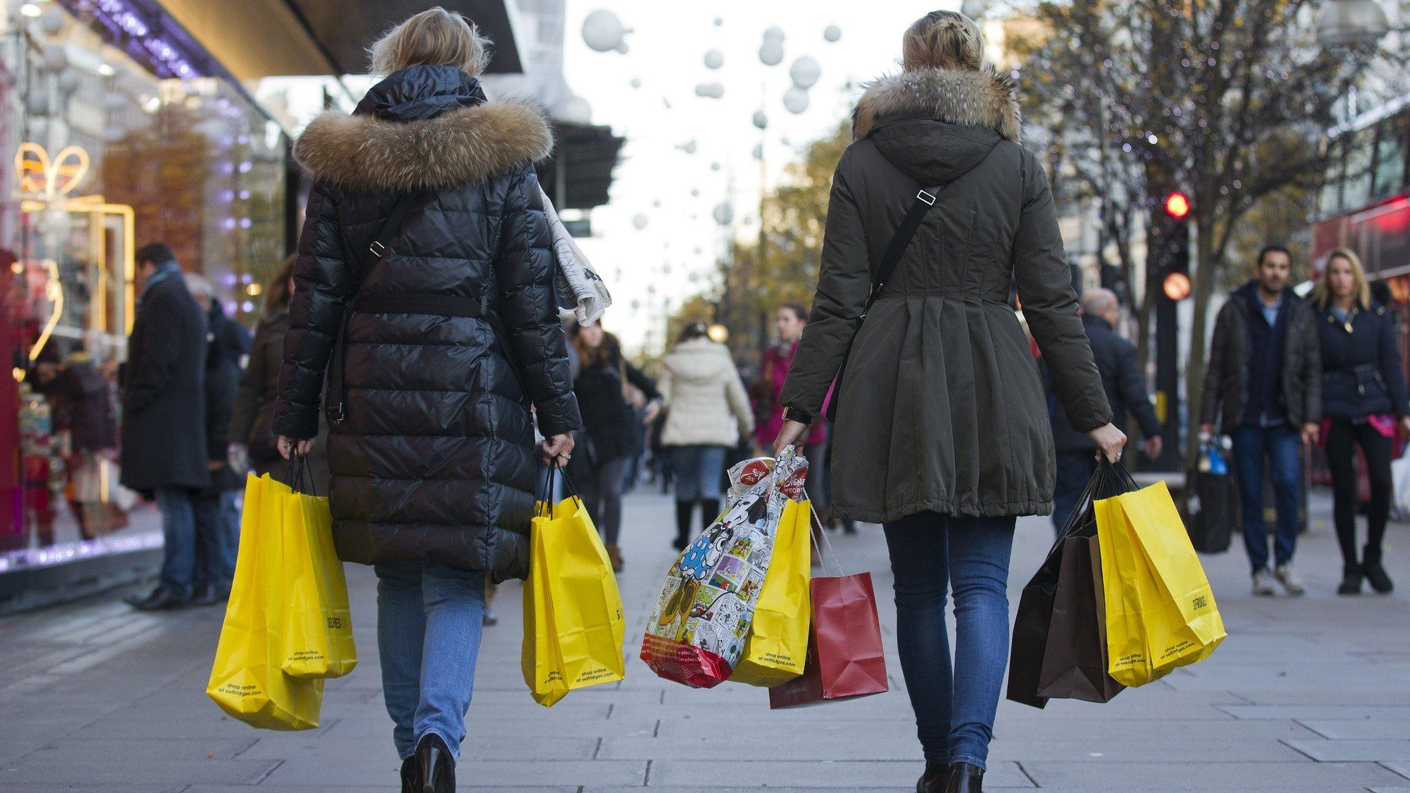 Shoppers on Oxford St from behind