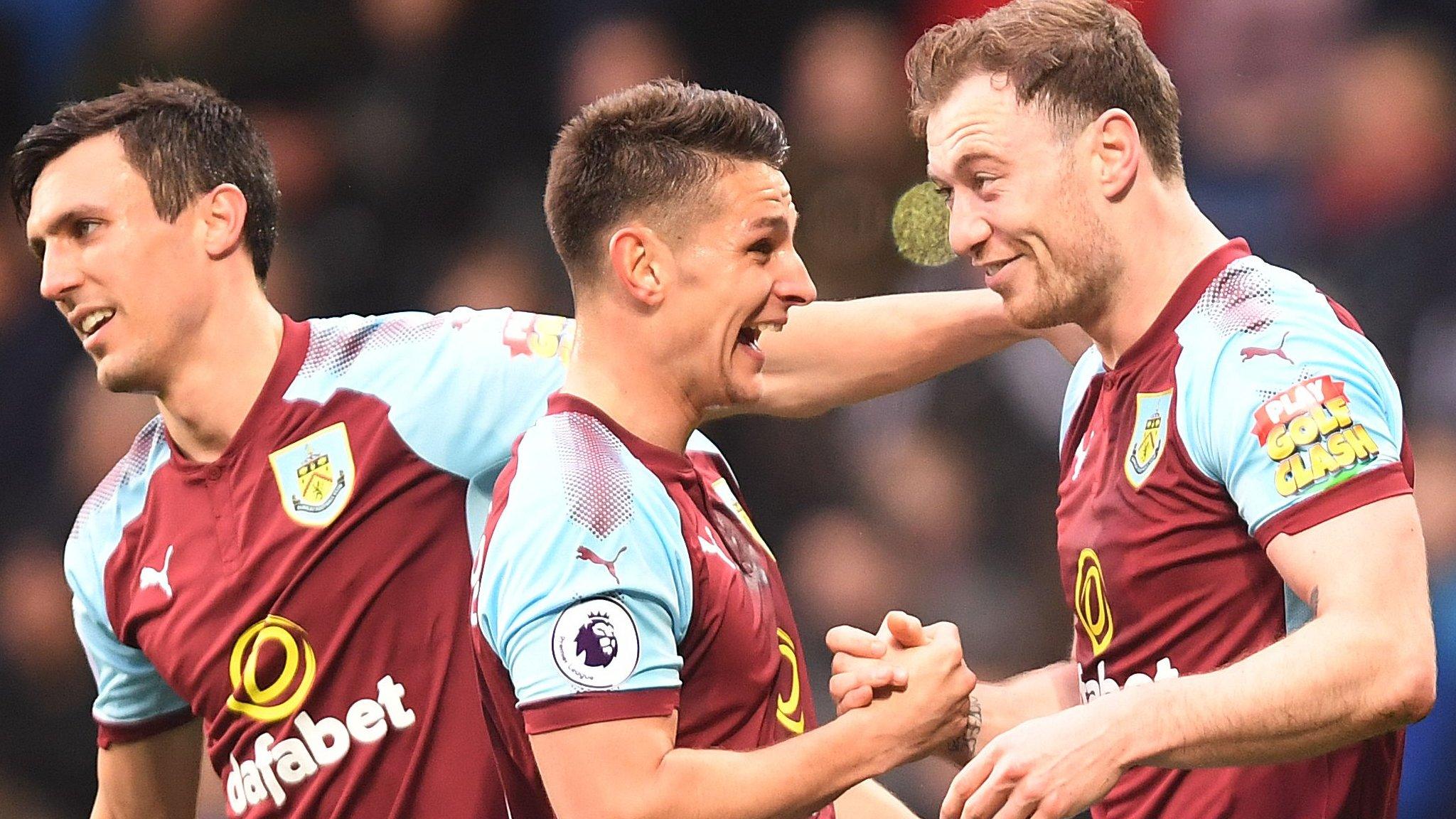 Burnley players celebrate with goalscorer Ashley Barnes