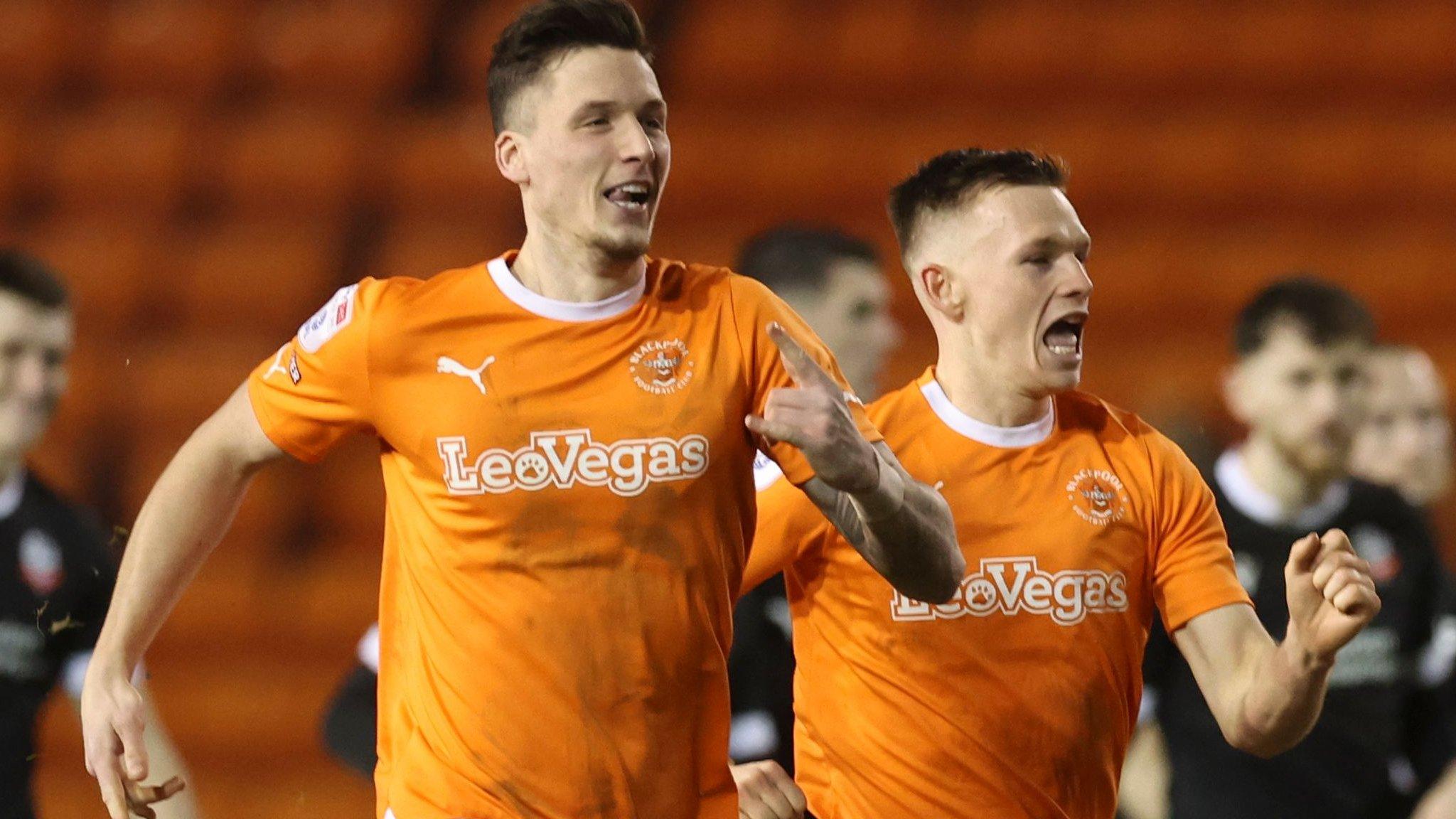 Blackpool players celebrates their penalty shootout victory over Bolton Wanderers at Bloomfield Road