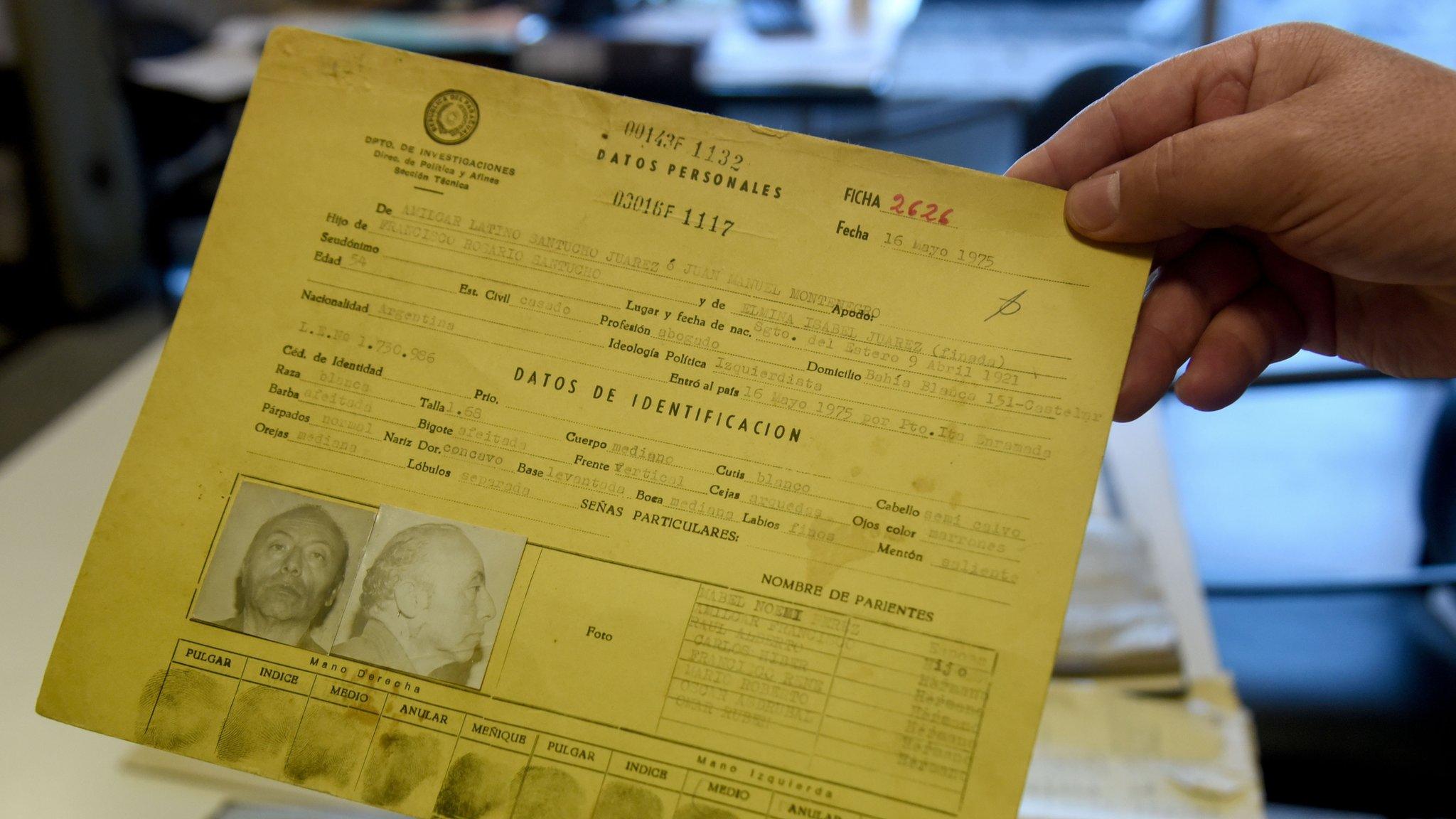 Paraguayan Judge Agustin Fernandez, director of the Documentation and Archive Center for Human Rights Defense, shows some of the documents that form part of the "Archives of Terror", at the Justice Palace in Asuncion, on January 16, 2019. -