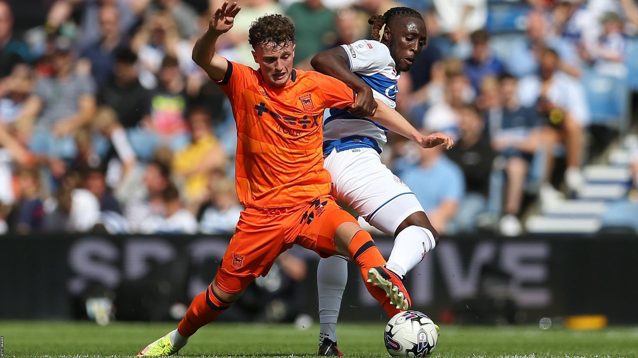 QPR's Osman Kakay (right) and Nathan Broadhead of Ipswich Town tussle for possession at Loftus Road