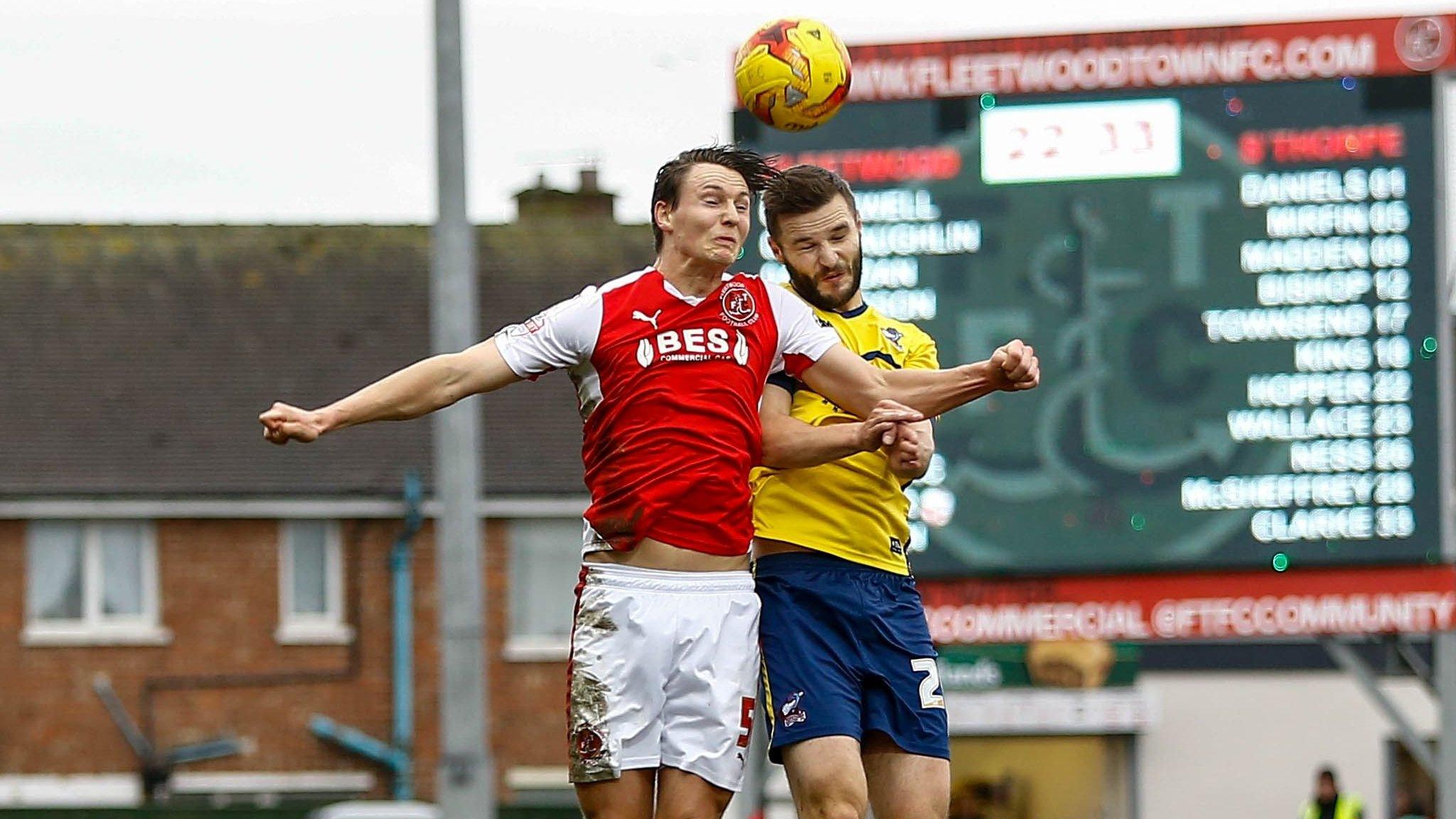 Scunthorpe's Jamie Ness (yellow) in action at Fleetwood