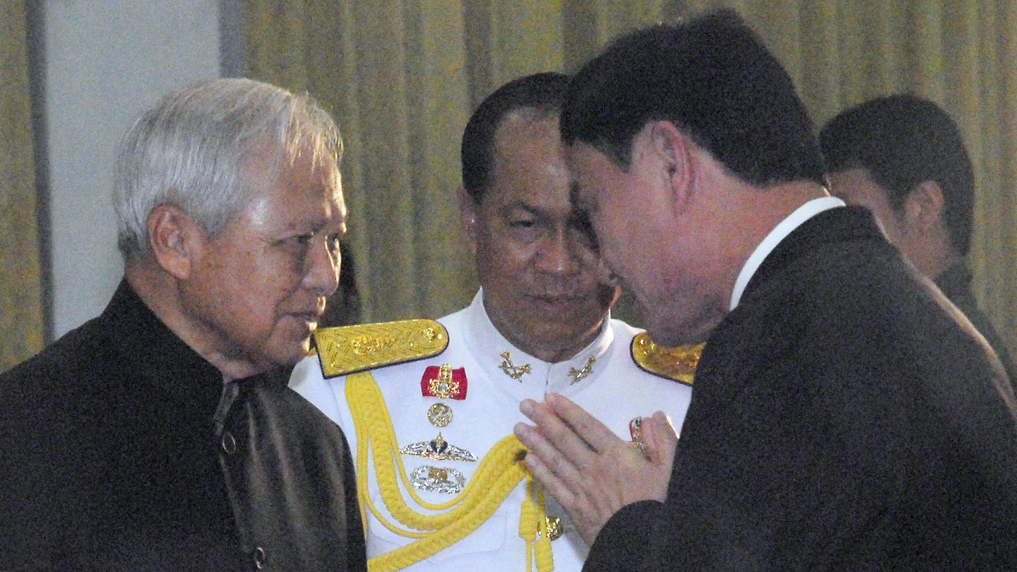 General Prem (left) is pictured receiving a traditional greeting from Thailand's former Prime Minister Thaksin Shina in 2008